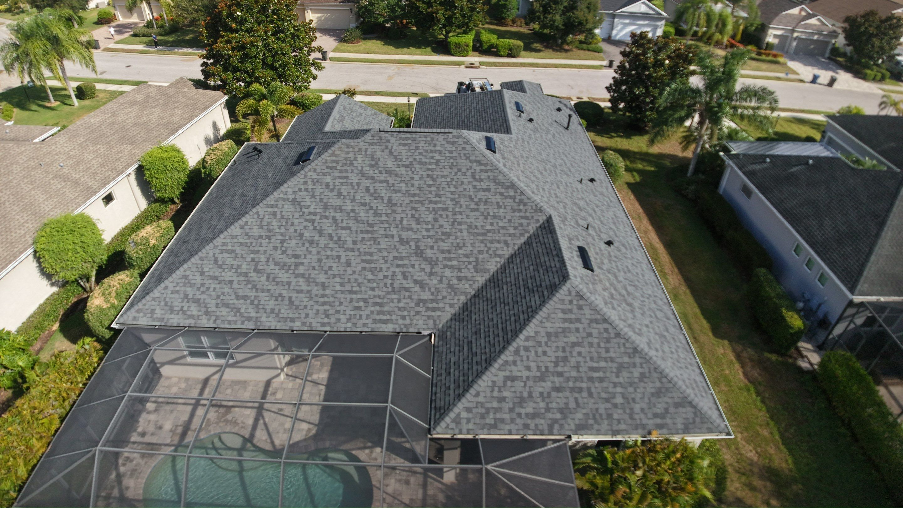 Residential Roof Installation With Estate Grey Architectural Shingles in Bradenton by Trinity Restoration and Roofing LLC
