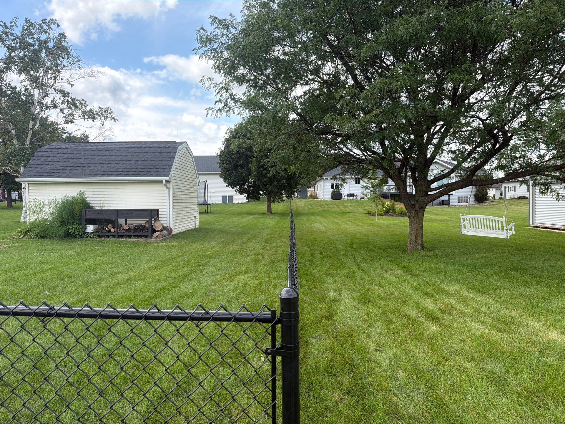 Black Vinyl-Coated Chain Link Fence Installation in Fairbank by Perfect Picket Fence and Stain