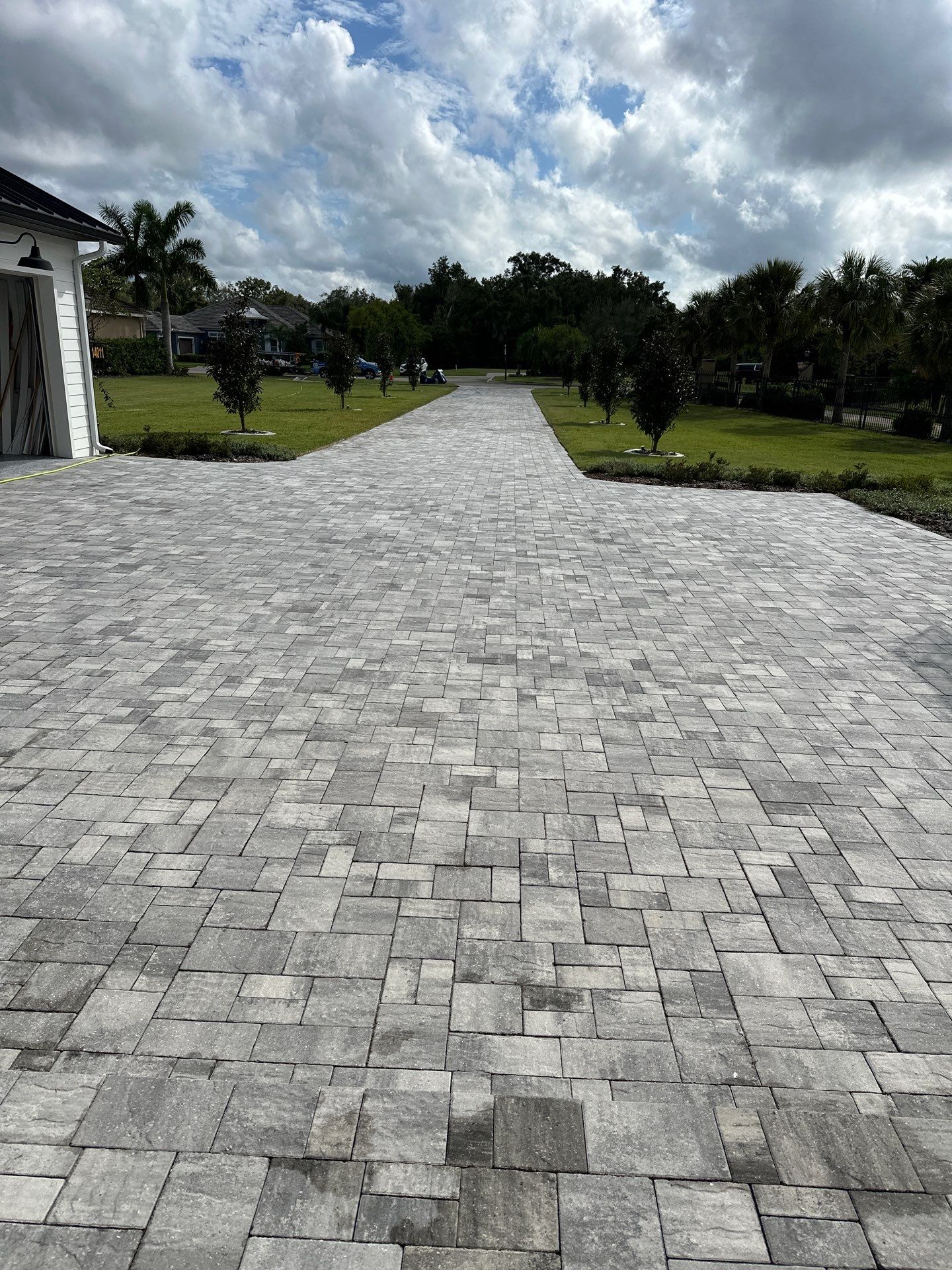Complete Two-Story House Wash and Driveway Cleaning in Winding River Community, Bradenton, FL by Sunshine AquaWash
