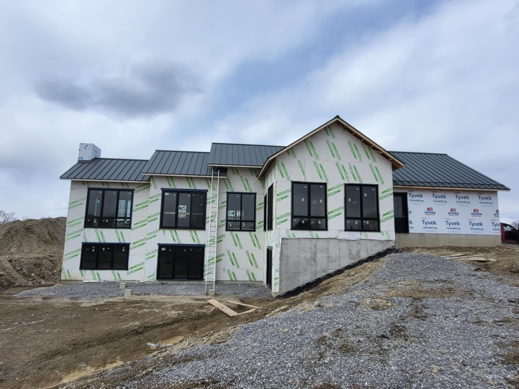 New Home Construction using 16" Standing Seam Panels by Jay Carter Roofing & Sheet Metal