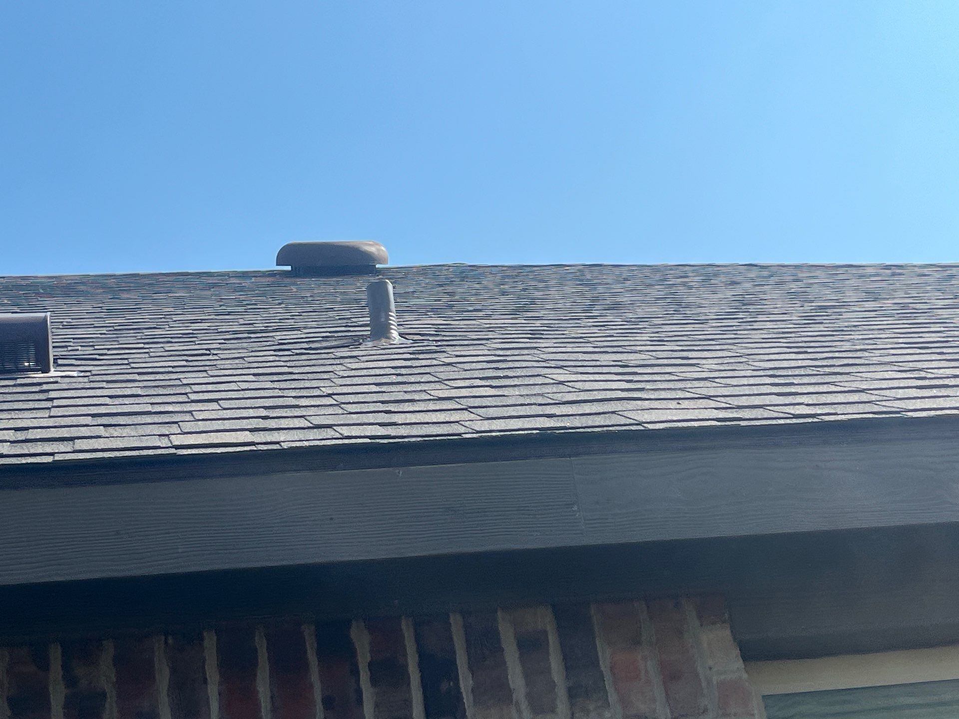 Medium brown brick with IKO Driftshake by Tejas Roofworks + Restoration