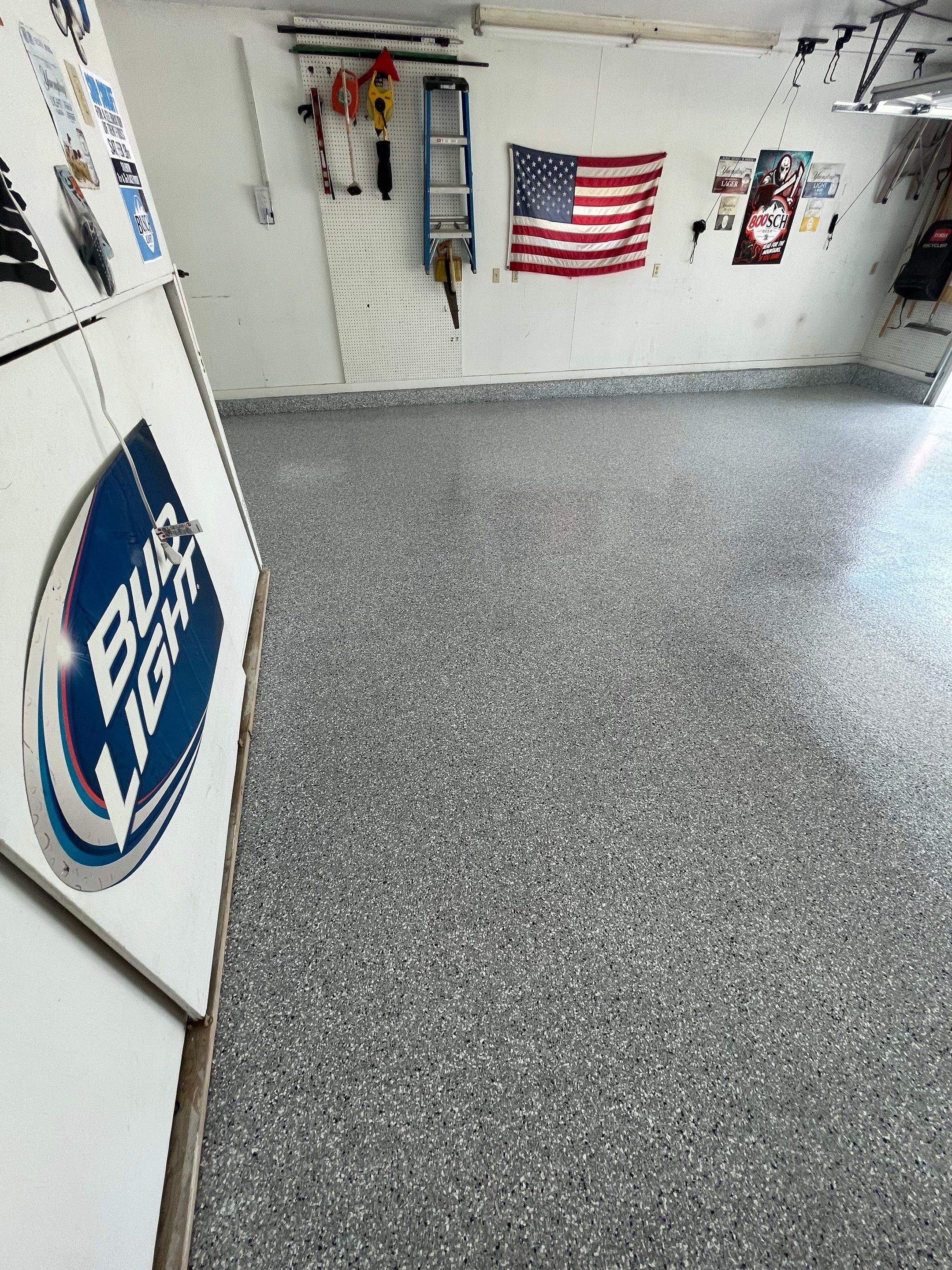 Residential Garage Floor Coating with Feather Grey Finish in Sioux Falls by Select Painting, Coatings & Garage Cabinets