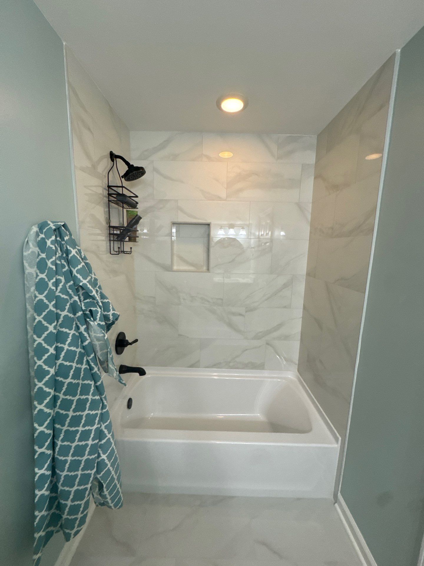 Modern Bathroom Transformation With Marble Patterned Tile in Powder Springs by Swift Home Renovations