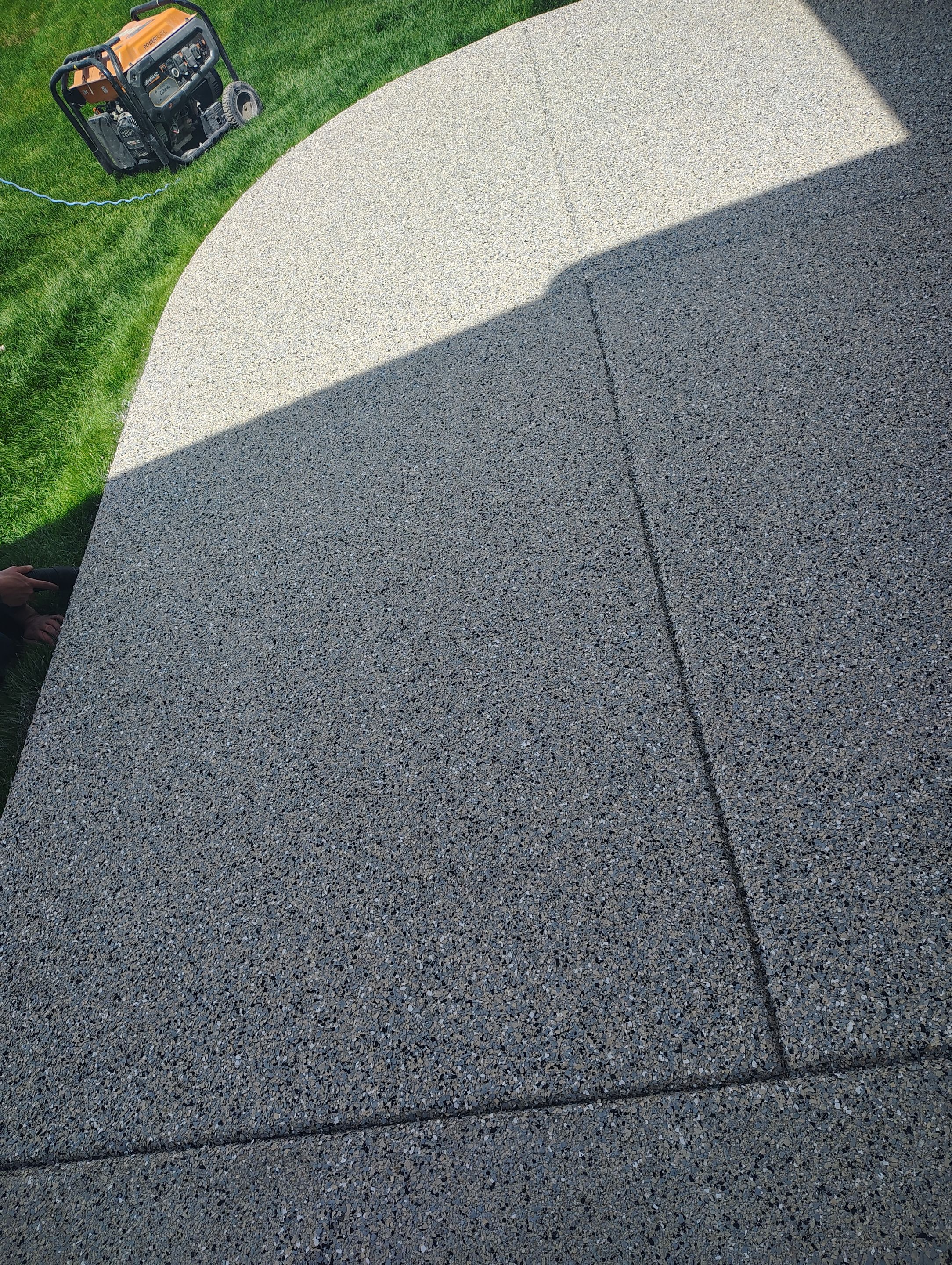 Speckled Concrete Patio Coating Installation in Sioux Falls by Select Painting, Coatings & Garage Cabinets