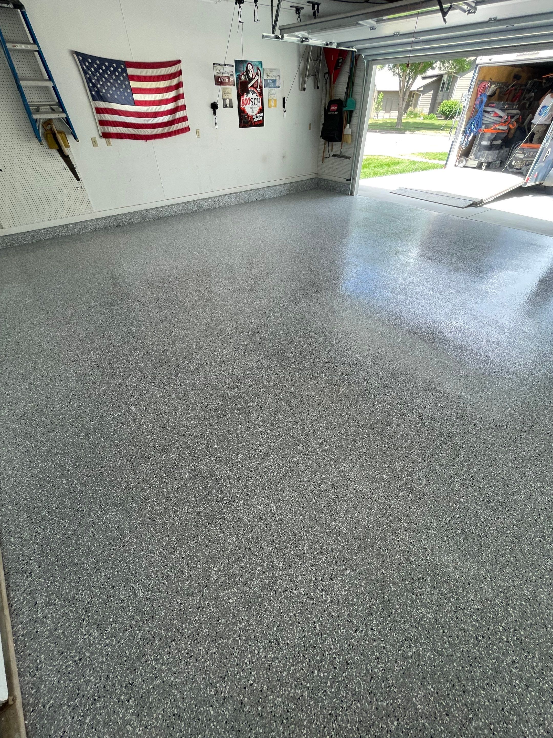 Residential Garage Floor Coating with Feather Grey Finish in Sioux Falls by Select Painting, Coatings & Garage Cabinets