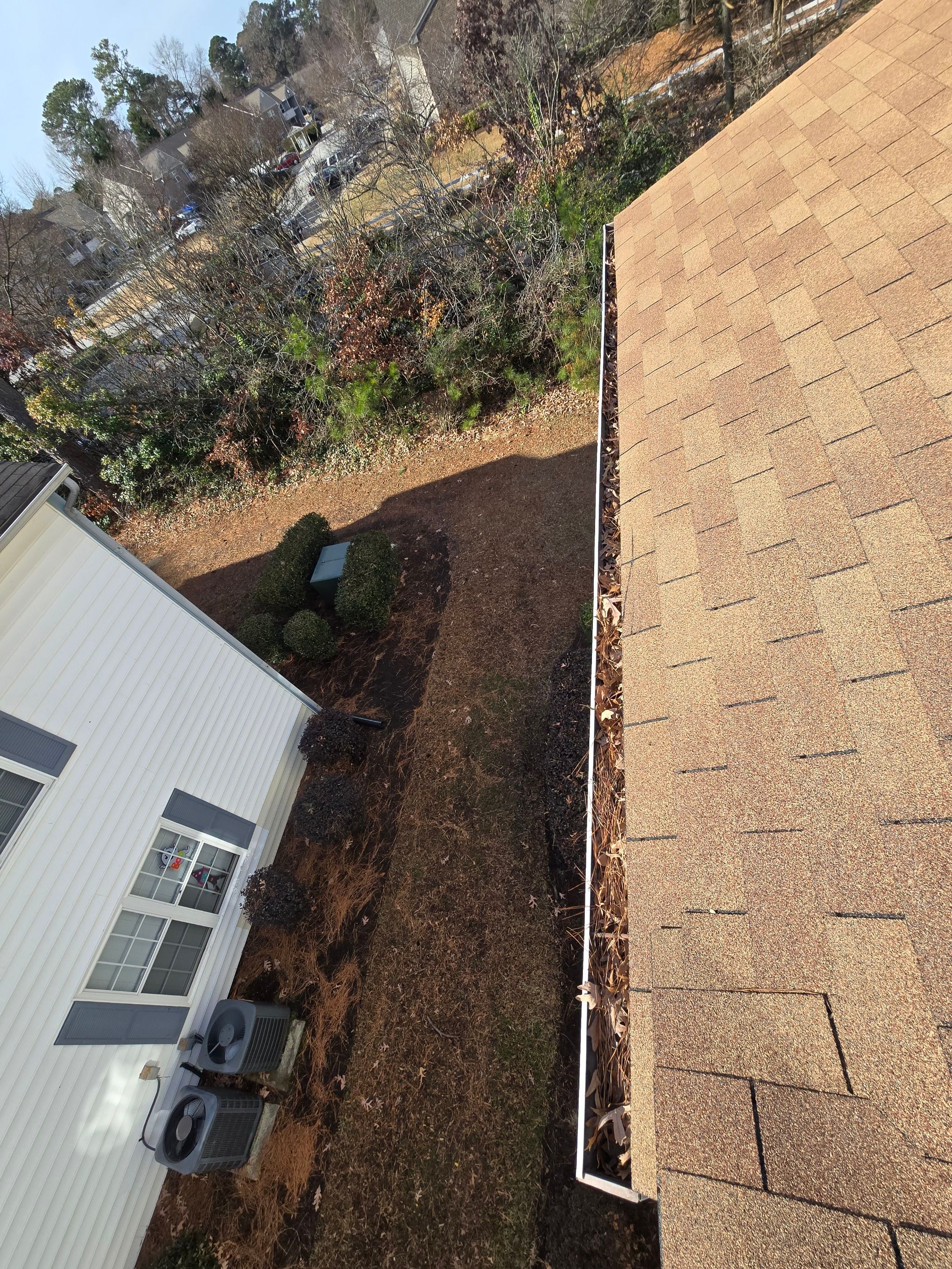 Commercial gutter cleaning Chesapeake, VA before photo with filled gutters