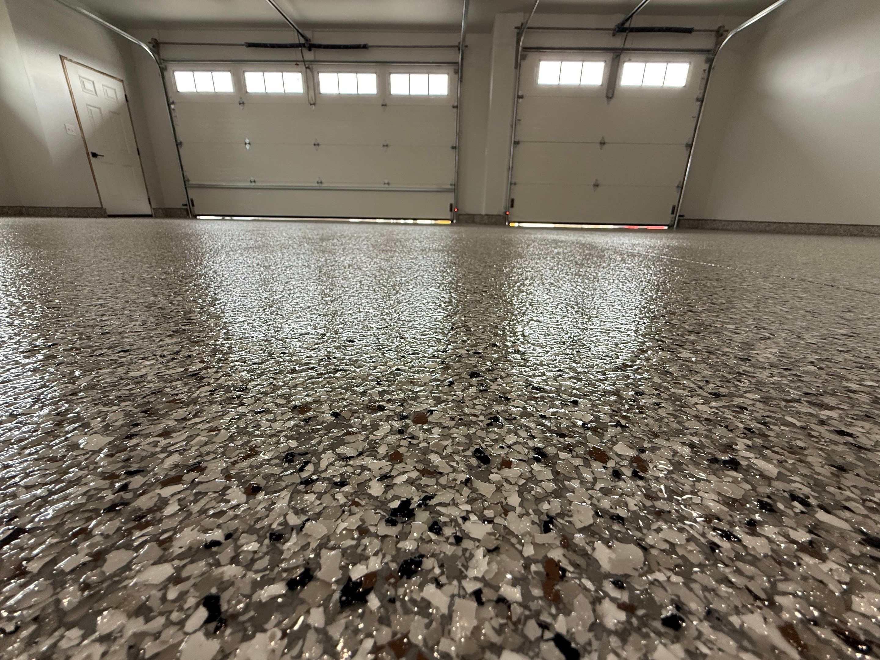 High-Gloss Epoxy Flake Garage Floor Coating in Brandon by Select Painting, Coatings & Garage Cabinets