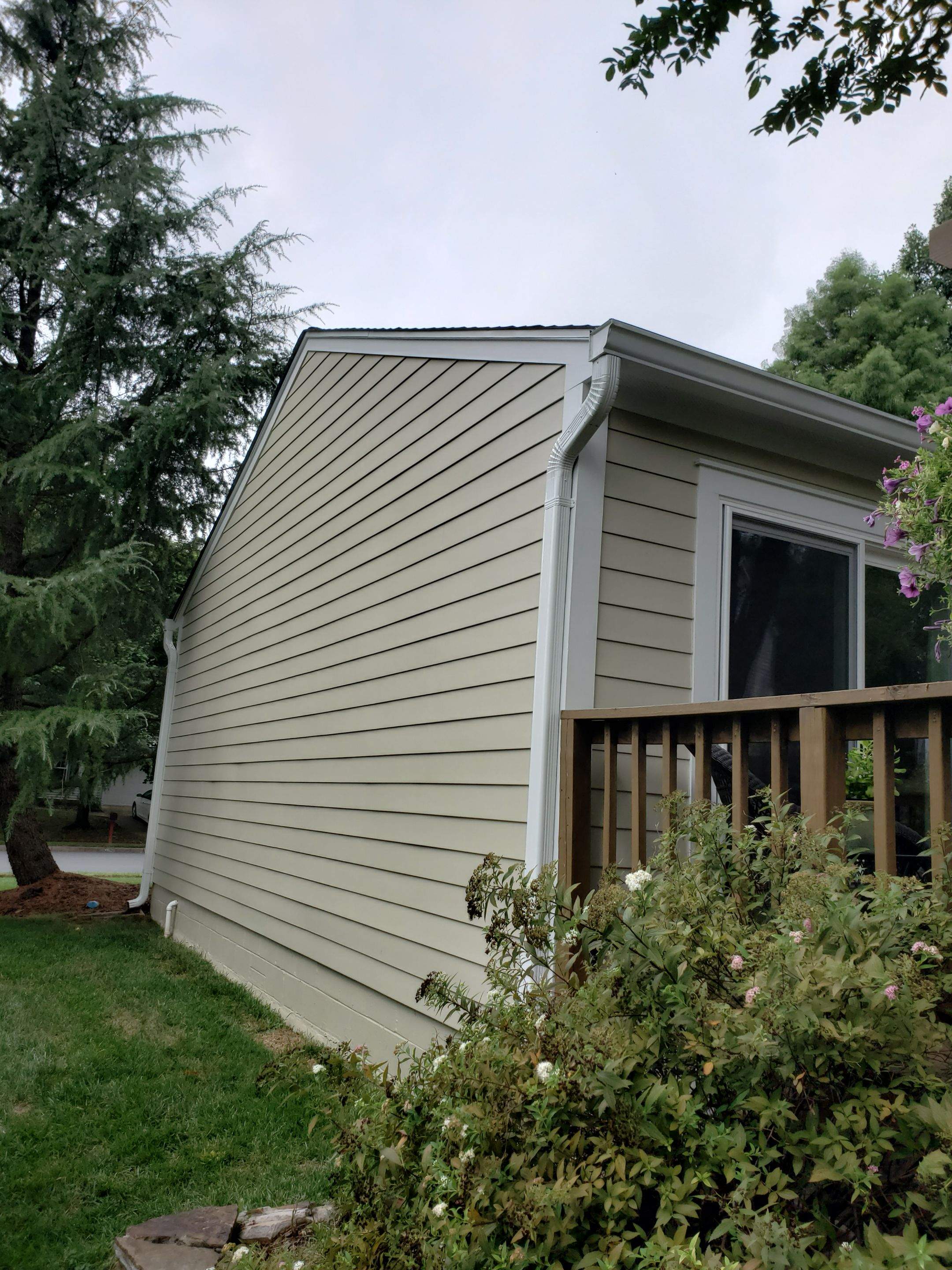 New composite windows and fiber cement siding with trim and gutters by Window Depot of Annapolis