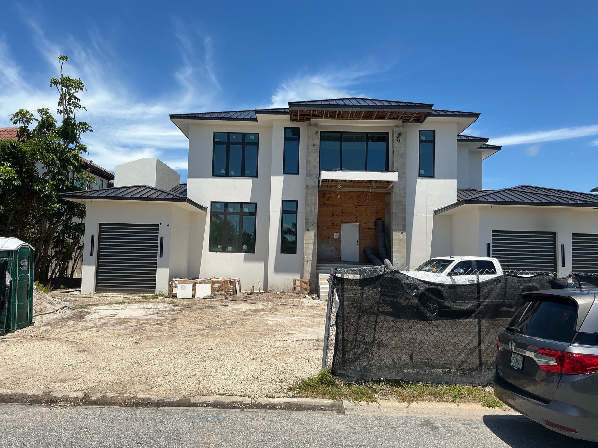 Seamless Aluminum Gutter Installation using black seamless gutters in Sarasota FL by Gutter Professors