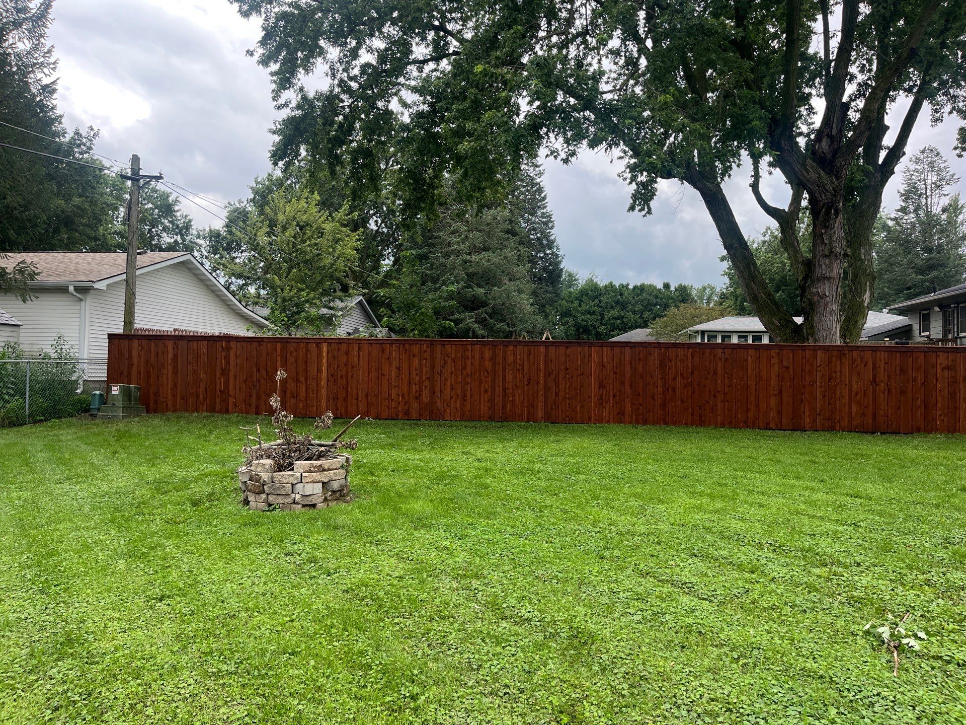 Board on Board Wood Privacy Fence Installation in Cedar Falls by Perfect Picket Fence and Stain