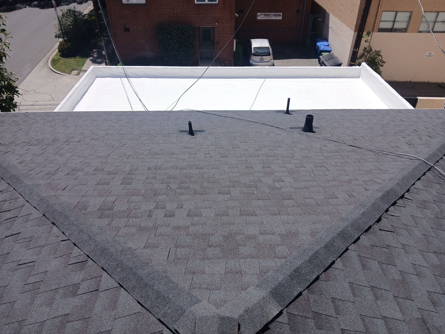 Apartment Building 2nd Layer Installation &Silicone coating by Hull Brothers Roofing