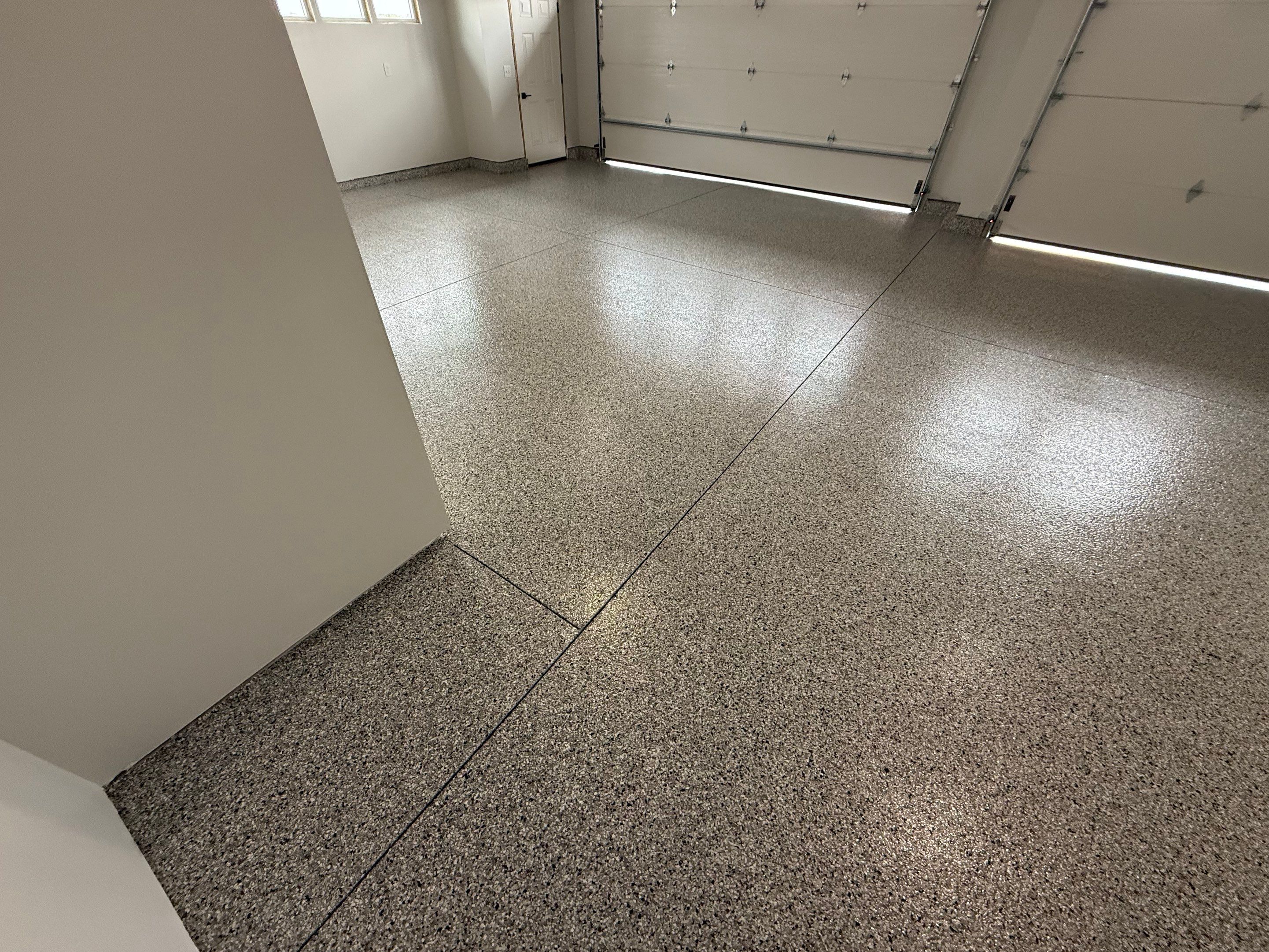 High-Gloss Epoxy Flake Garage Floor Coating in Brandon by Select Painting, Coatings & Garage Cabinets