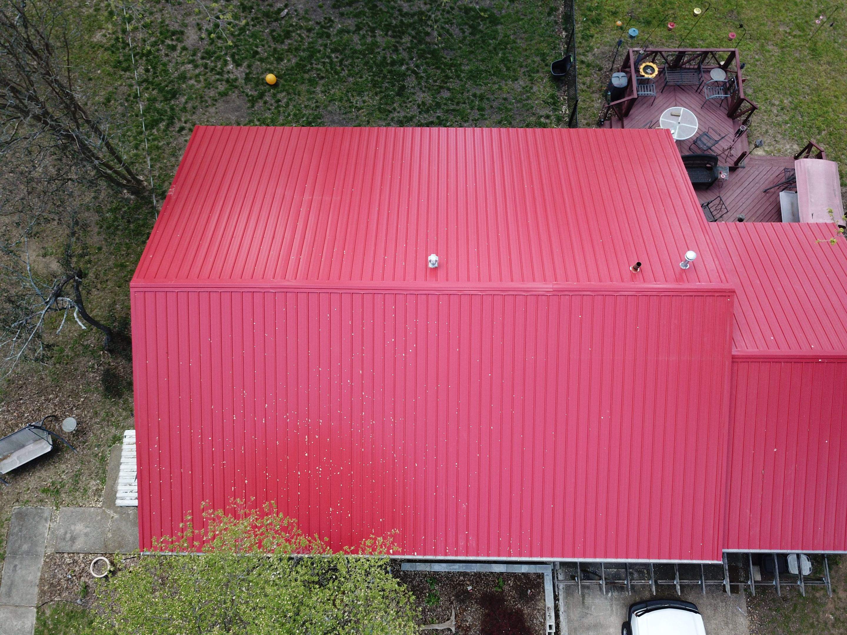 Residential Roofing Installation using 26 Gauge Colored Panels by Hostetler Roofing