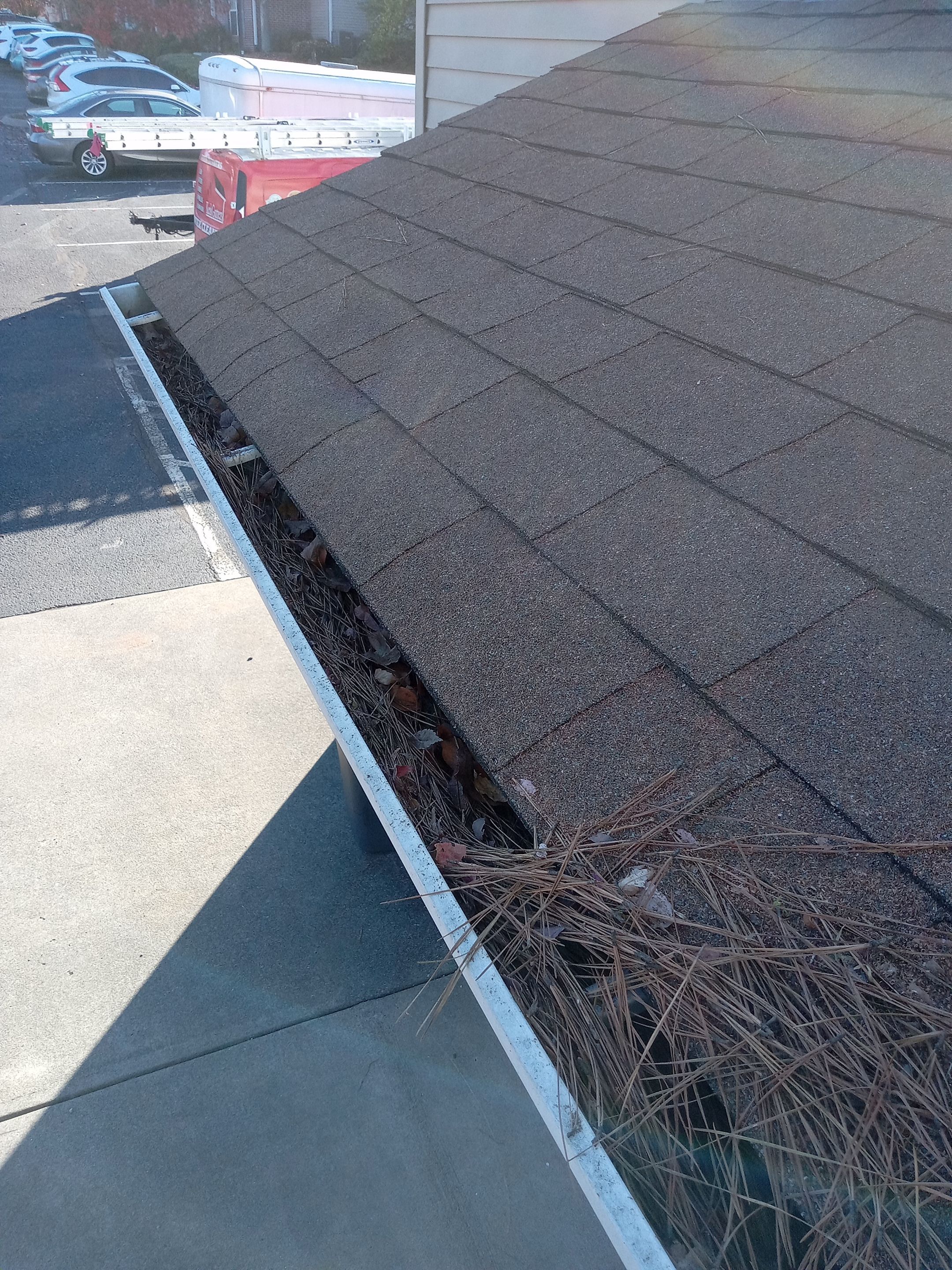 Commercial gutter cleaning Knoxville, before photo with filled gutters