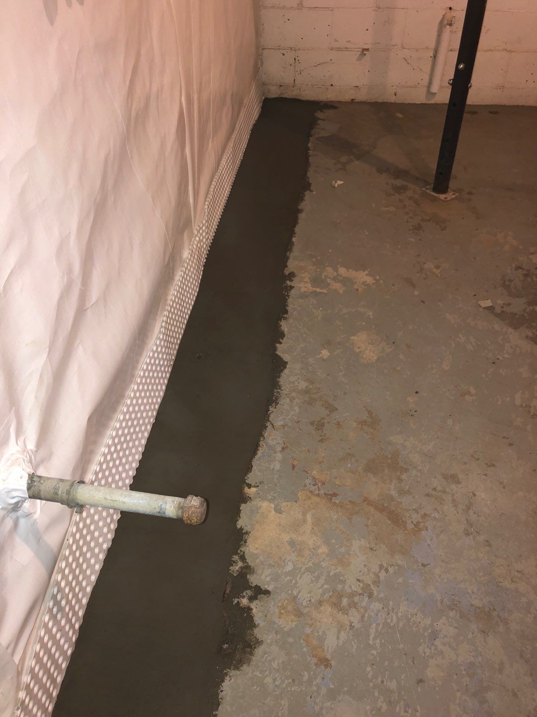 Basement Waterproofing using Drain tile system and a foundation wrap by ACE Waterproofing & Basement Solutions