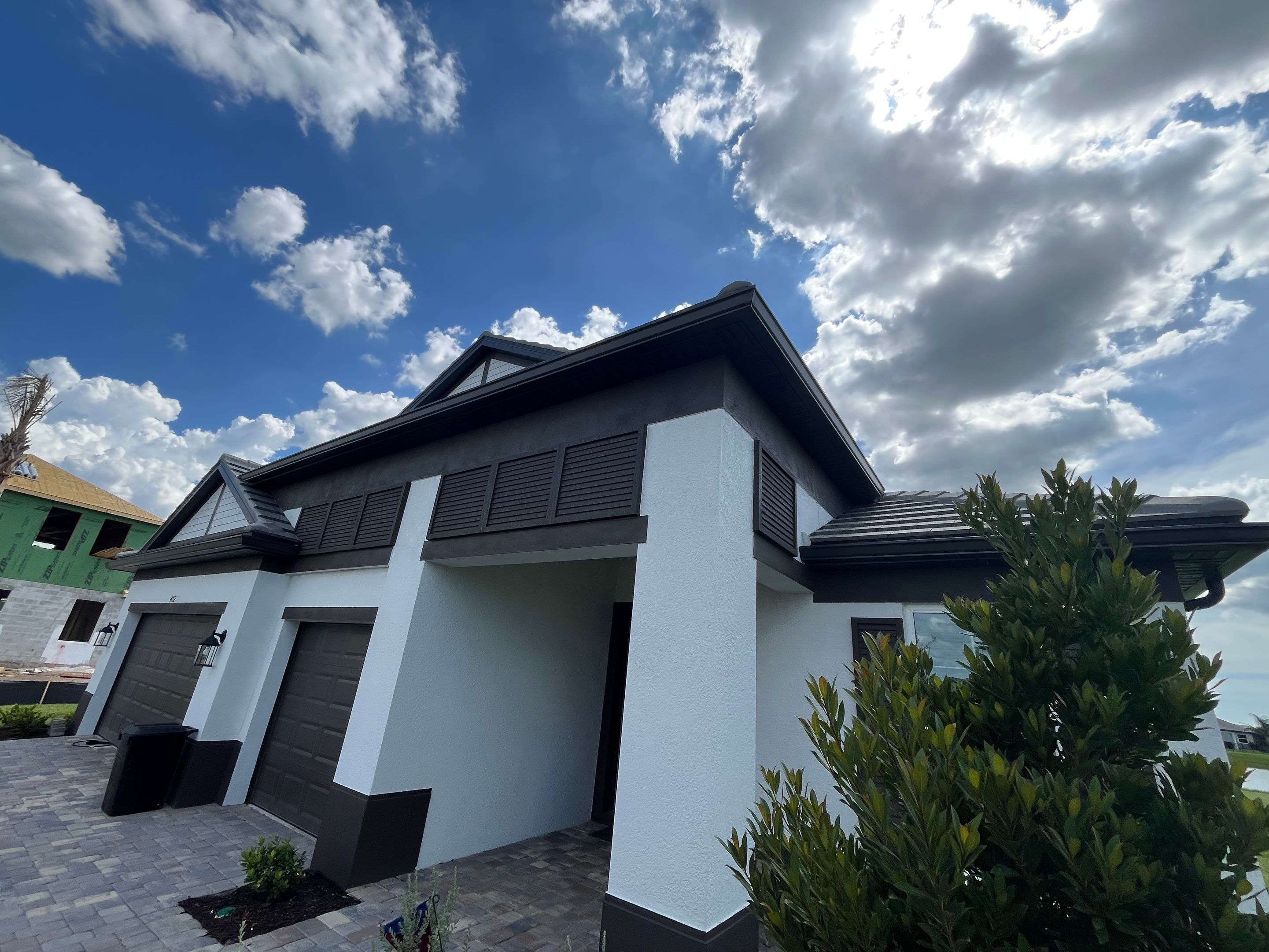 Modern Black Bronze Seamless Gutters for a Stylish Home by Gutter Professors