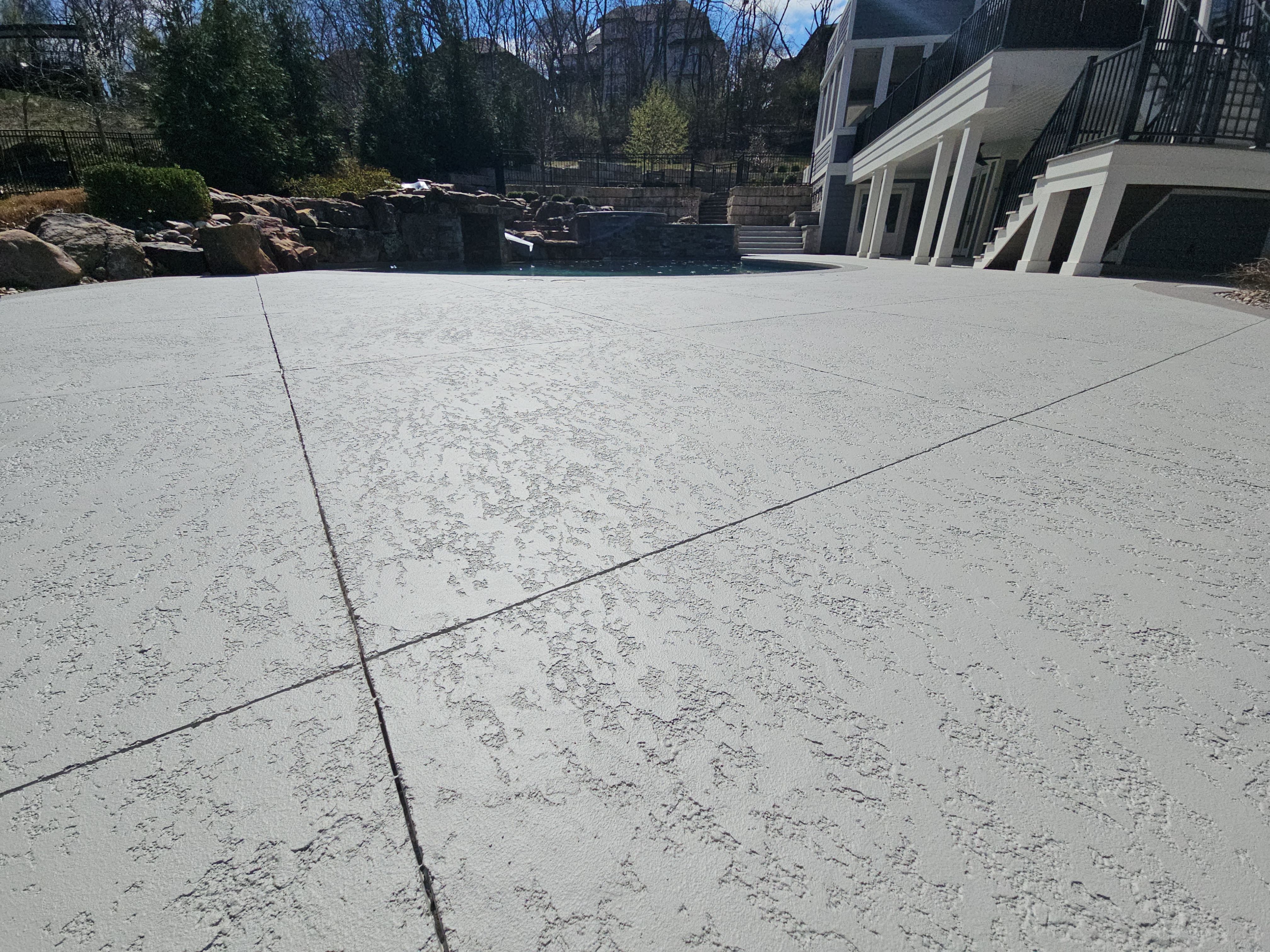 Stilwell, KS -- Pool Deck Resurfacing by Big Red Decorative Concrete, LLC