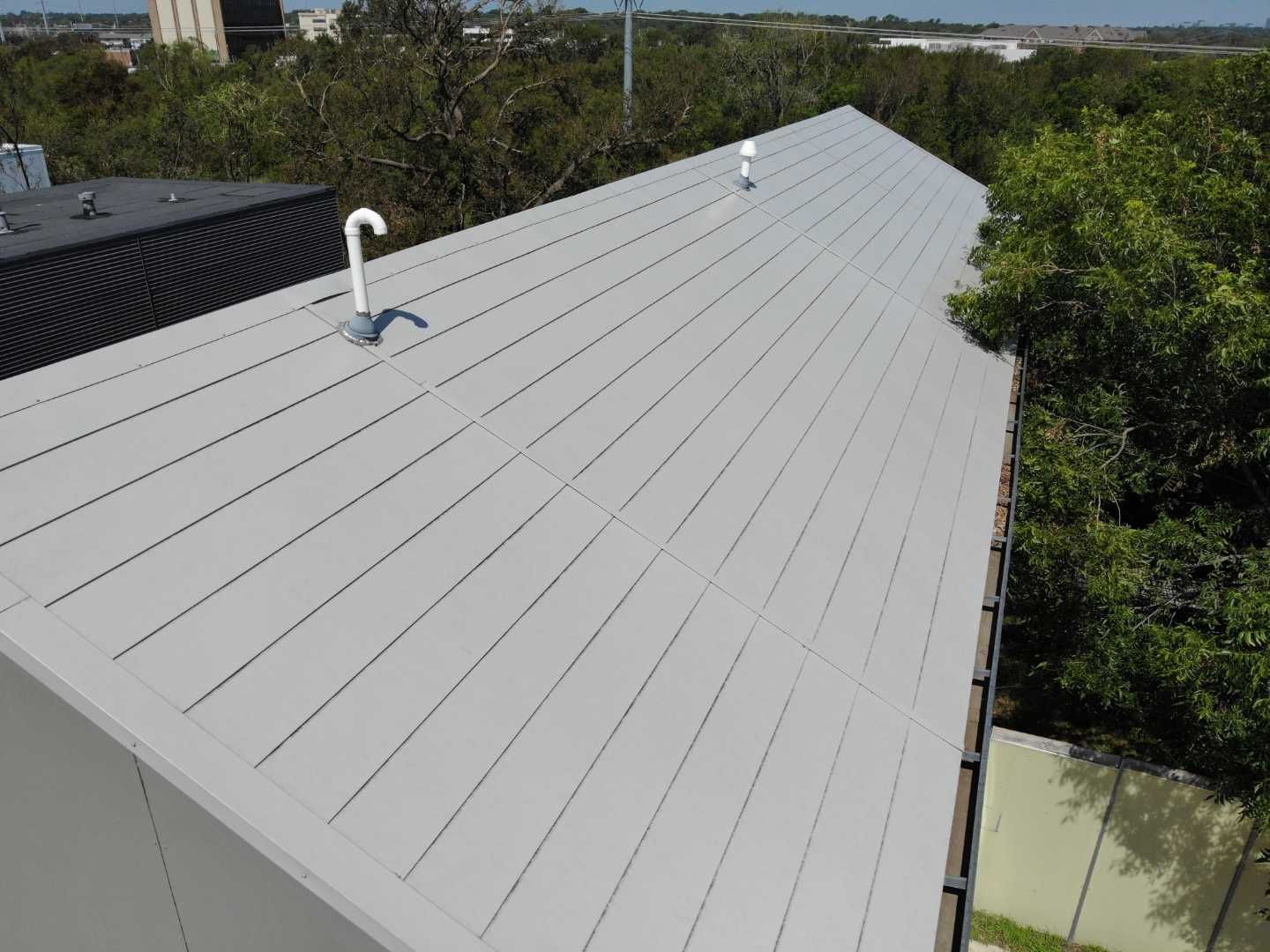 Metal Roofing project using MBCI Flexloc Panels - 22 gauge - silver metallic-in-color by Becker Roofing and Exteriors