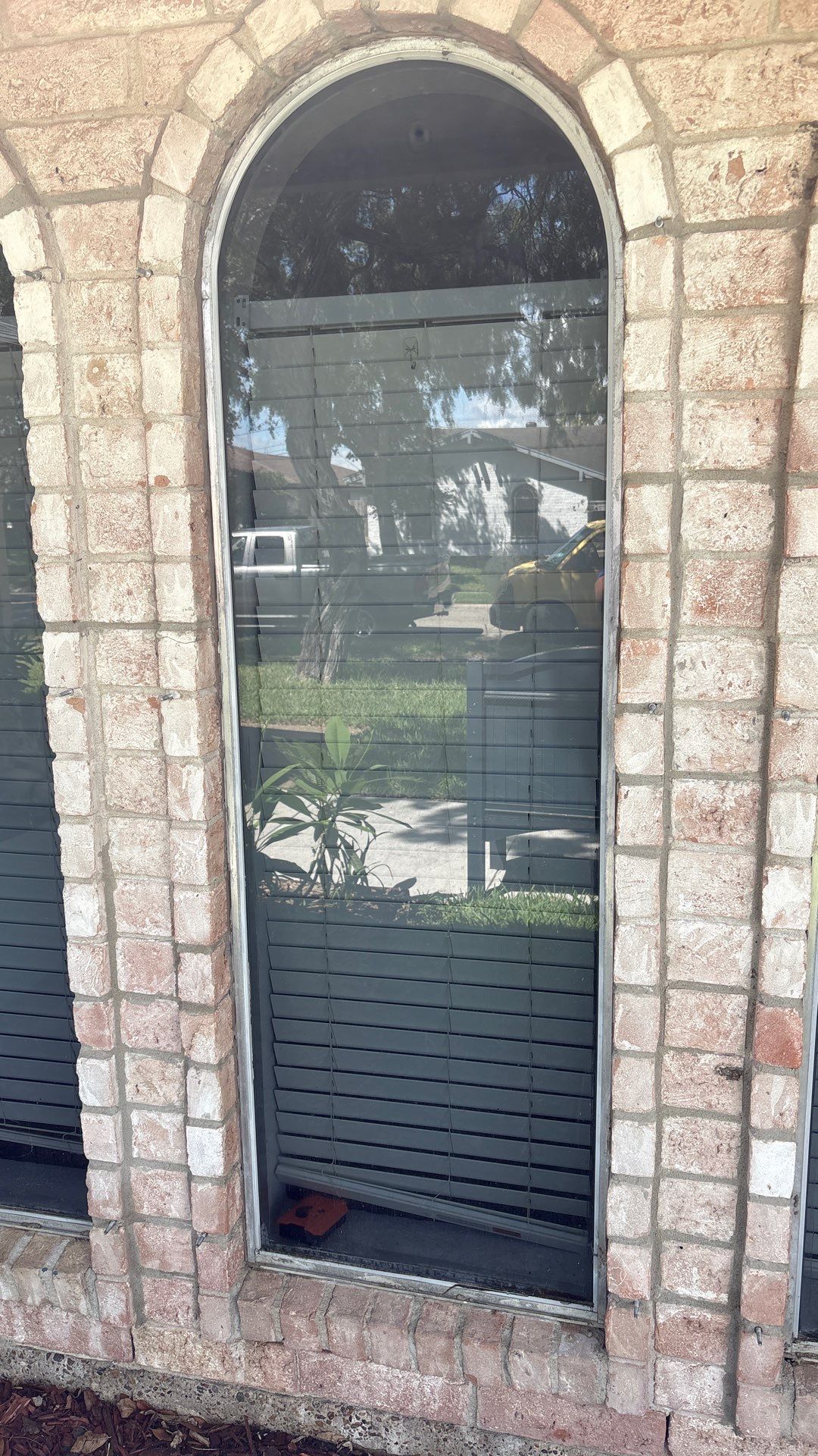 Colored Vinyl Windows to blend into brick by Bayfront Roofing and Construction