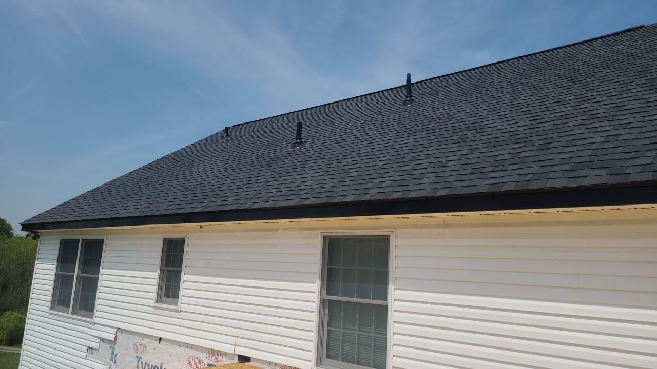 Roof Damage using Certainteed Lifetime Roofing System- Moire Black Landmark Pro shingkes with shadow ridge caps. by BulletpROOF Exteriors