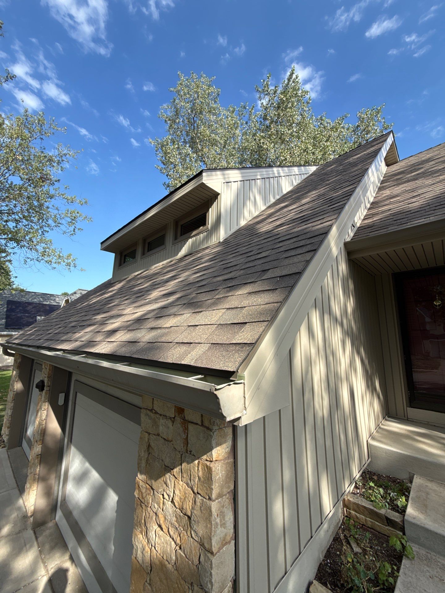 Comprehensive Kansas City Exterior Remodel Featuring Board And Batten Siding by EEC Windows, Siding & Roofing