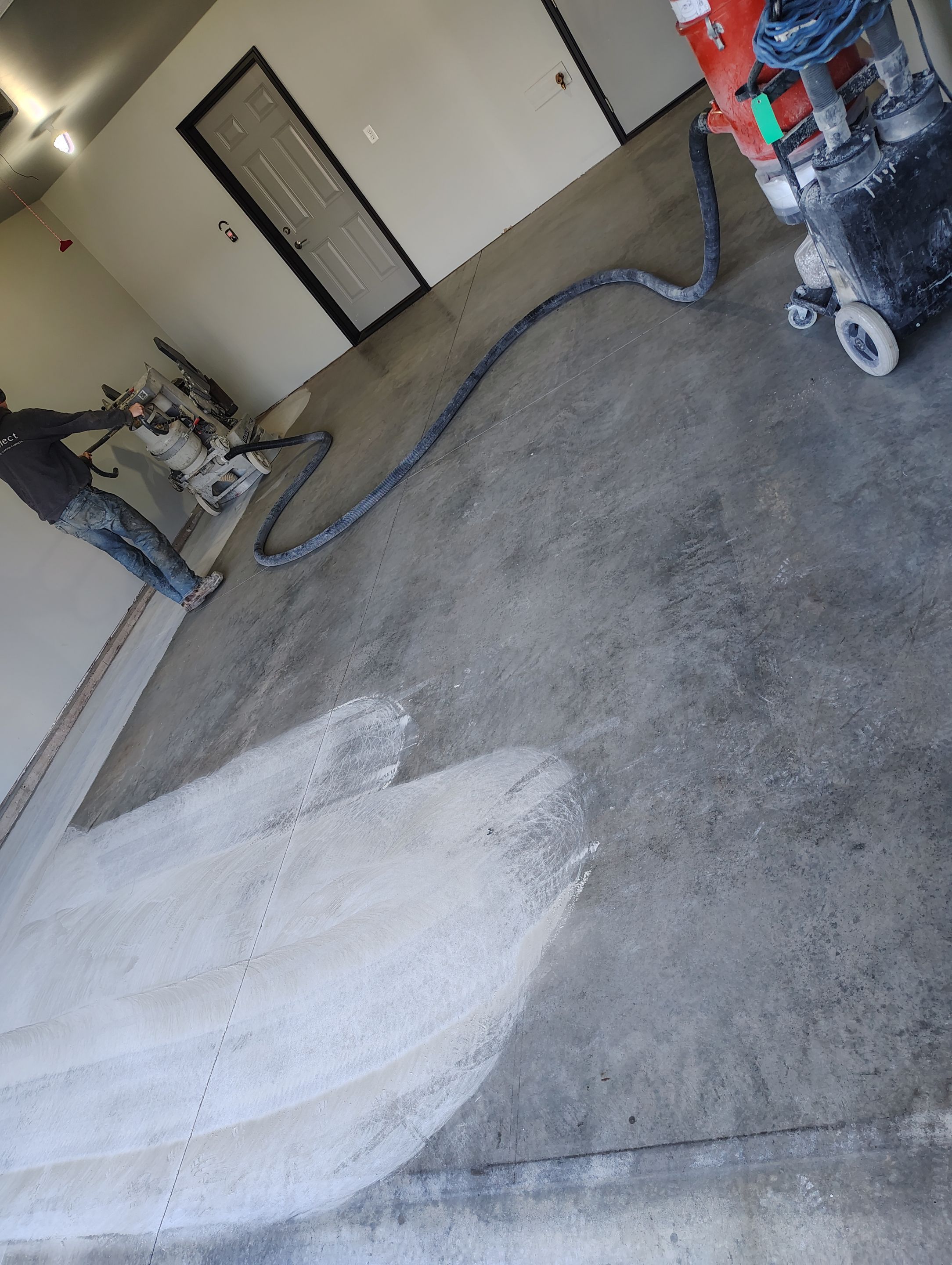 Custom Epoxy Garage Floor Coating Installation in Sioux Falls by Select Painting, Coatings & Garage Cabinets