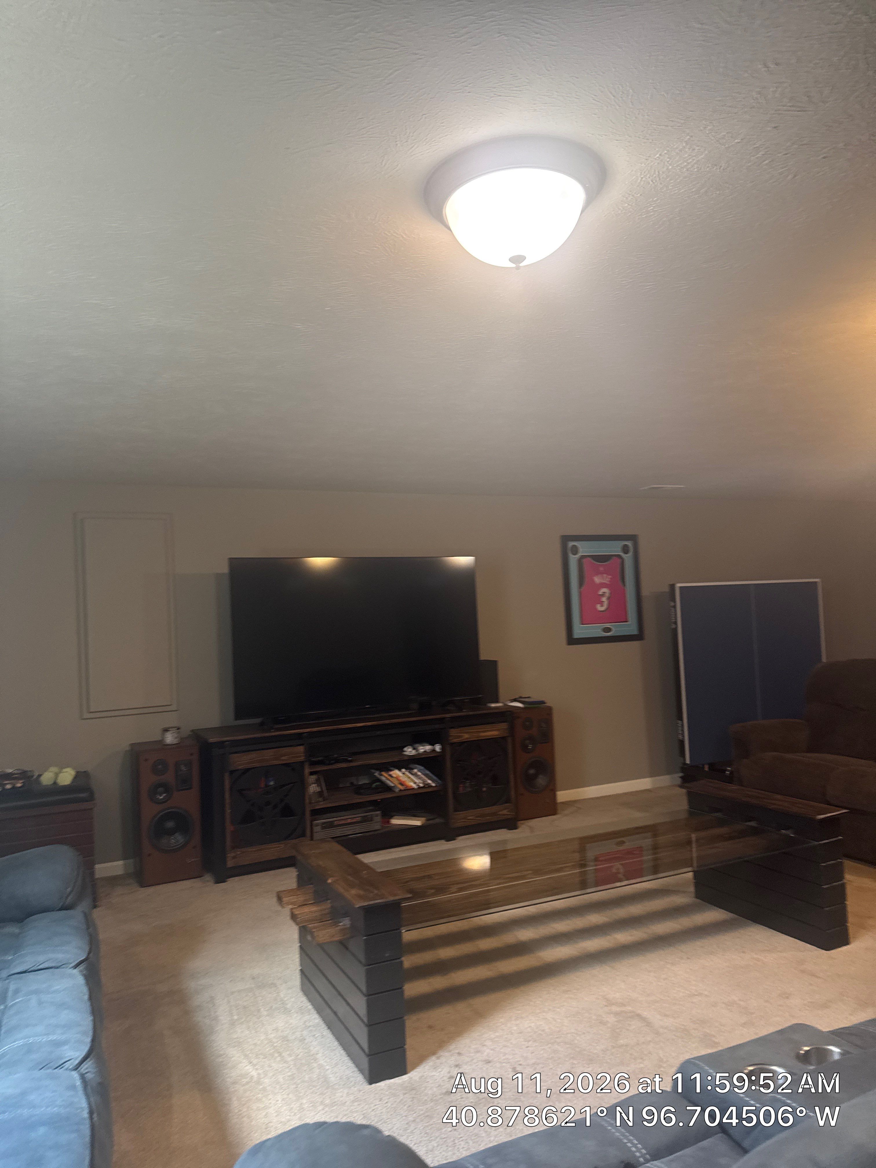 Basement Remodel Featuring Egress Window and Integrated Media Center by CompanyCam Sales Demo