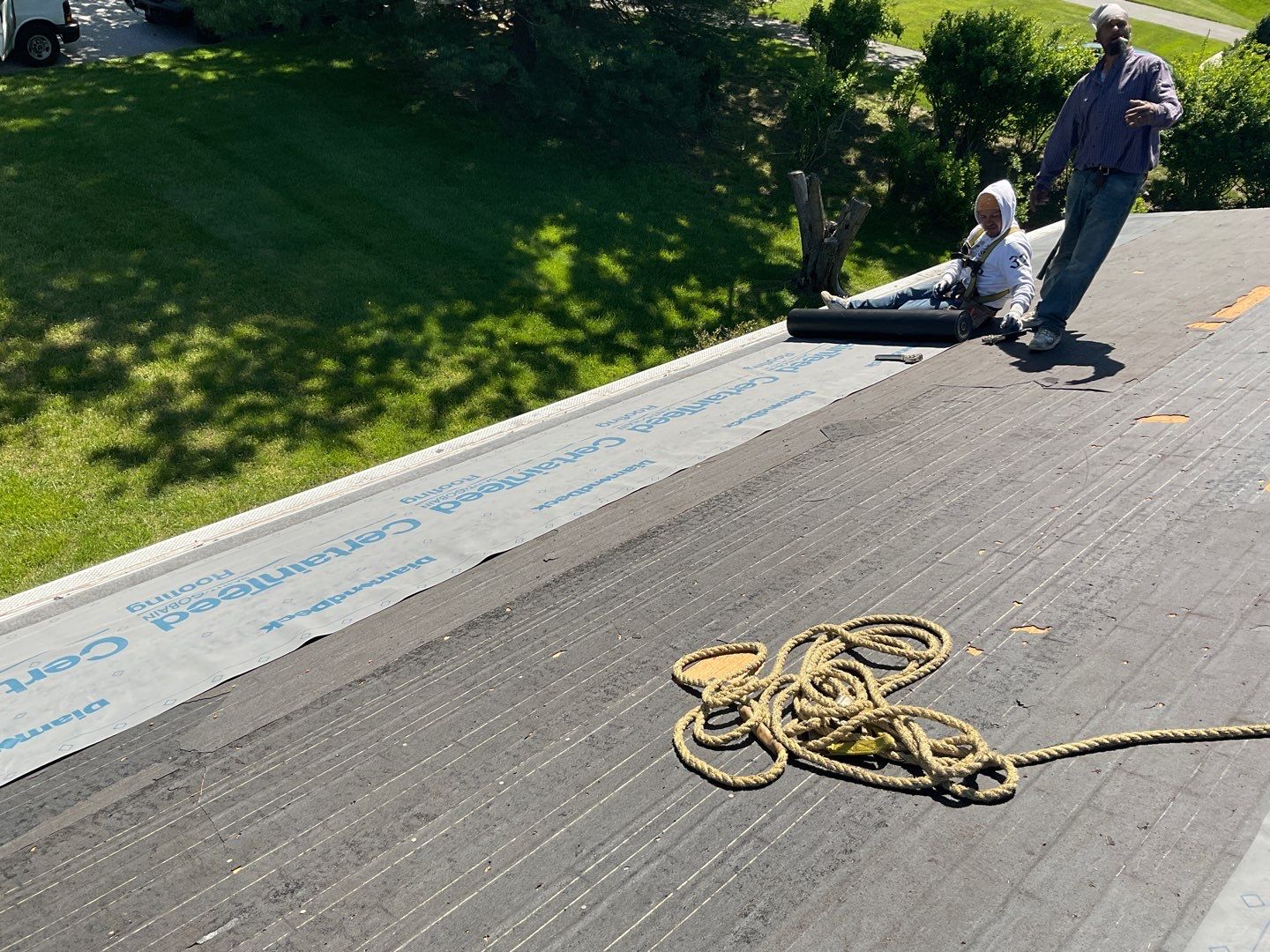 Residential Roofing Installation using Landmark Shingles Color Weatherwood by Alpha Design Services