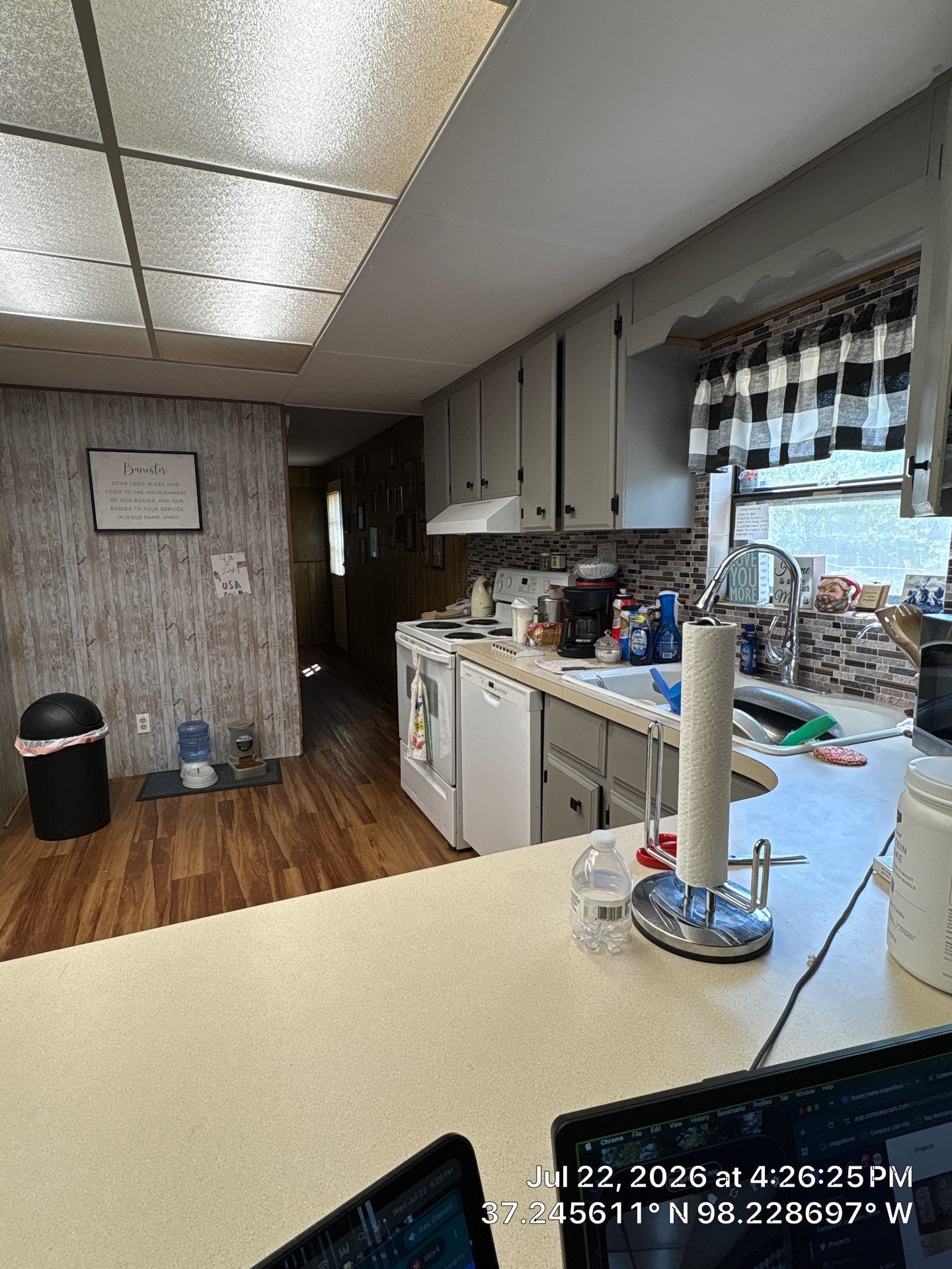 Kitchen Renovation Featuring Grey Cabinetry and Laminate Flooring in Attica by CompanyCam Sales Demo