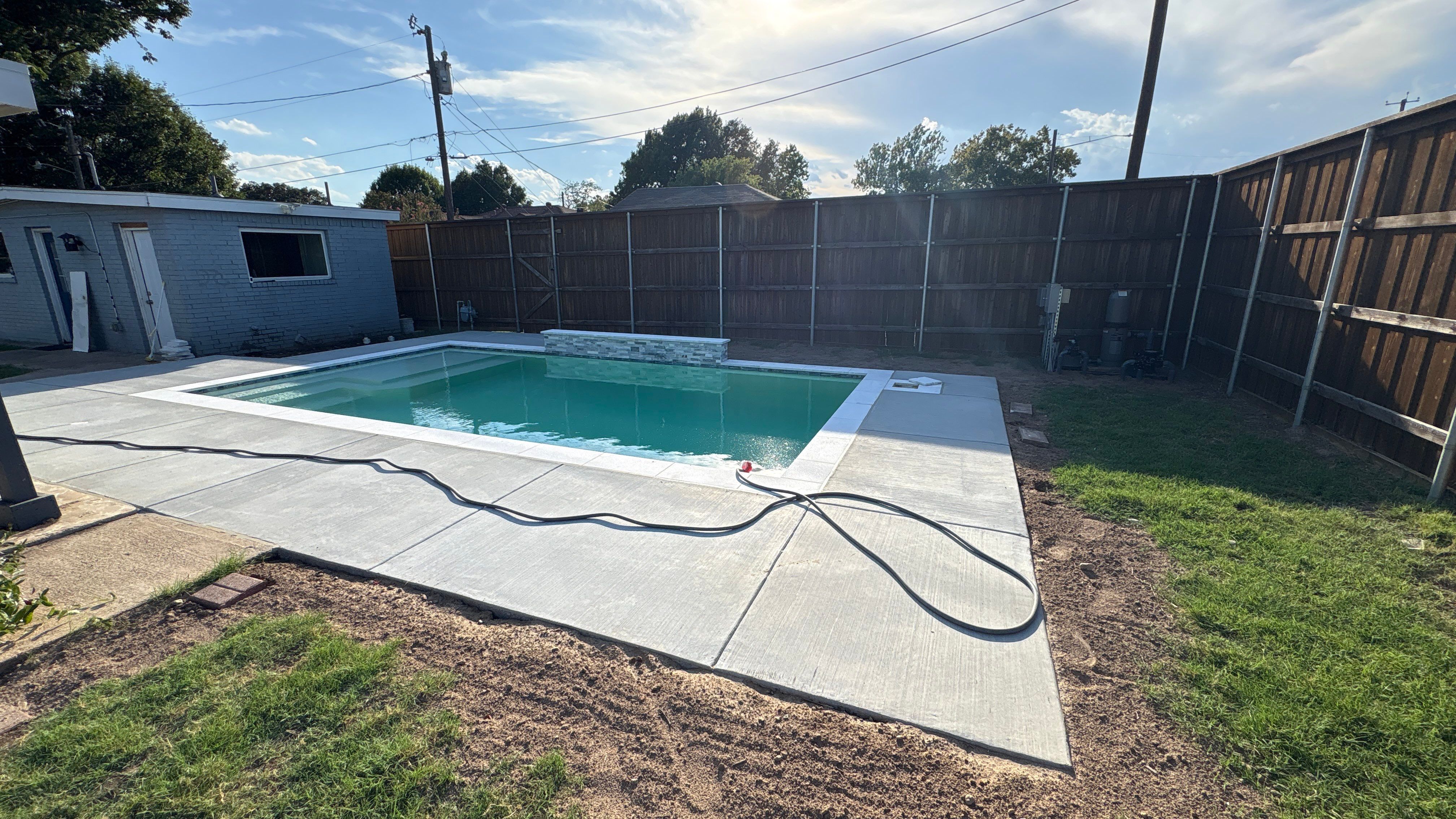 Compact Geometric Pool with Crisp White Interior by Pinnacle Pools and Spas - DFW