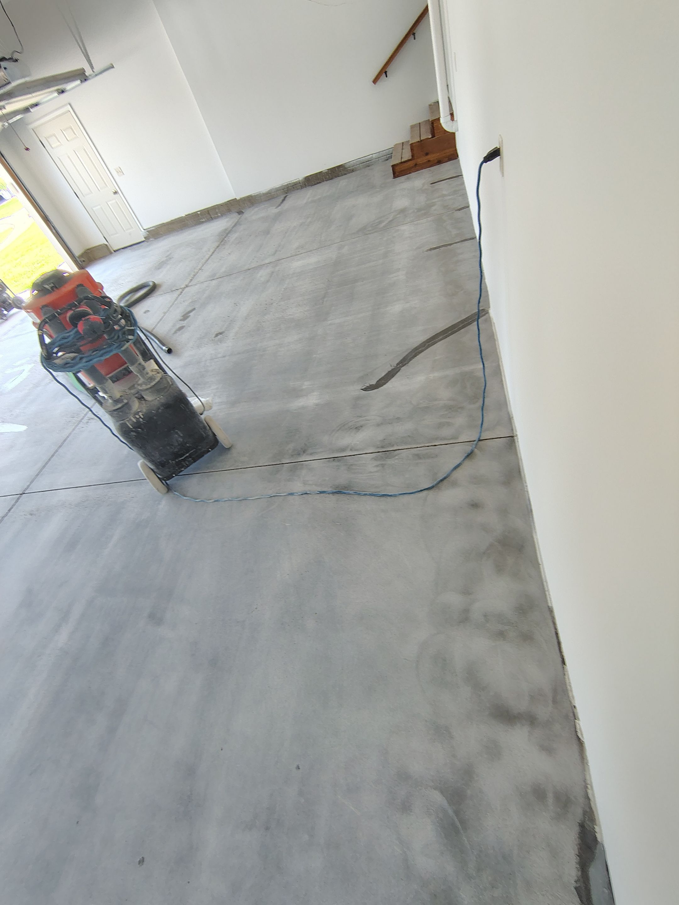 Custom Grey Speckled Epoxy Floor Coating for Sioux Falls Garage by Select Painting, Coatings & Garage Cabinets