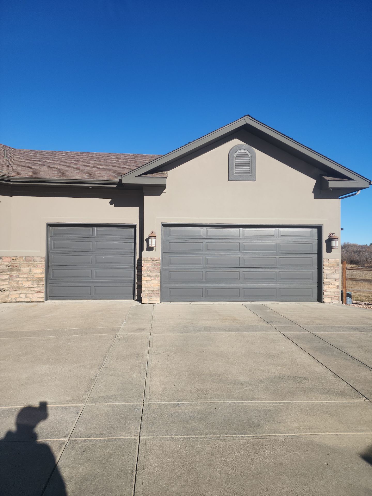 Castle Rock Elegance: White Stucco Exterior with Bold Tricorn Black by J&M Painting LLC