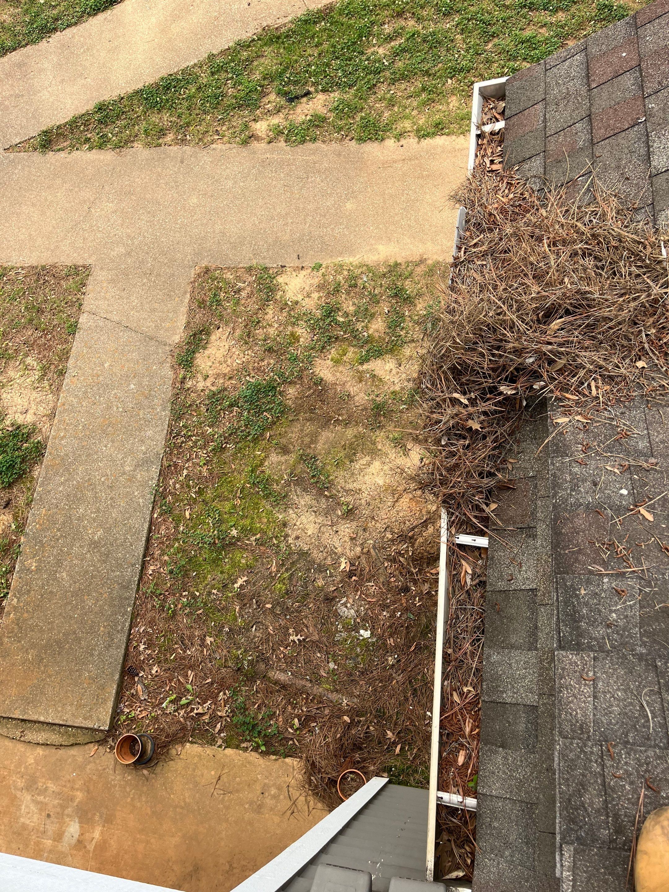 Commercial gutter cleaning Tyler & Longview before photo with filled gutters