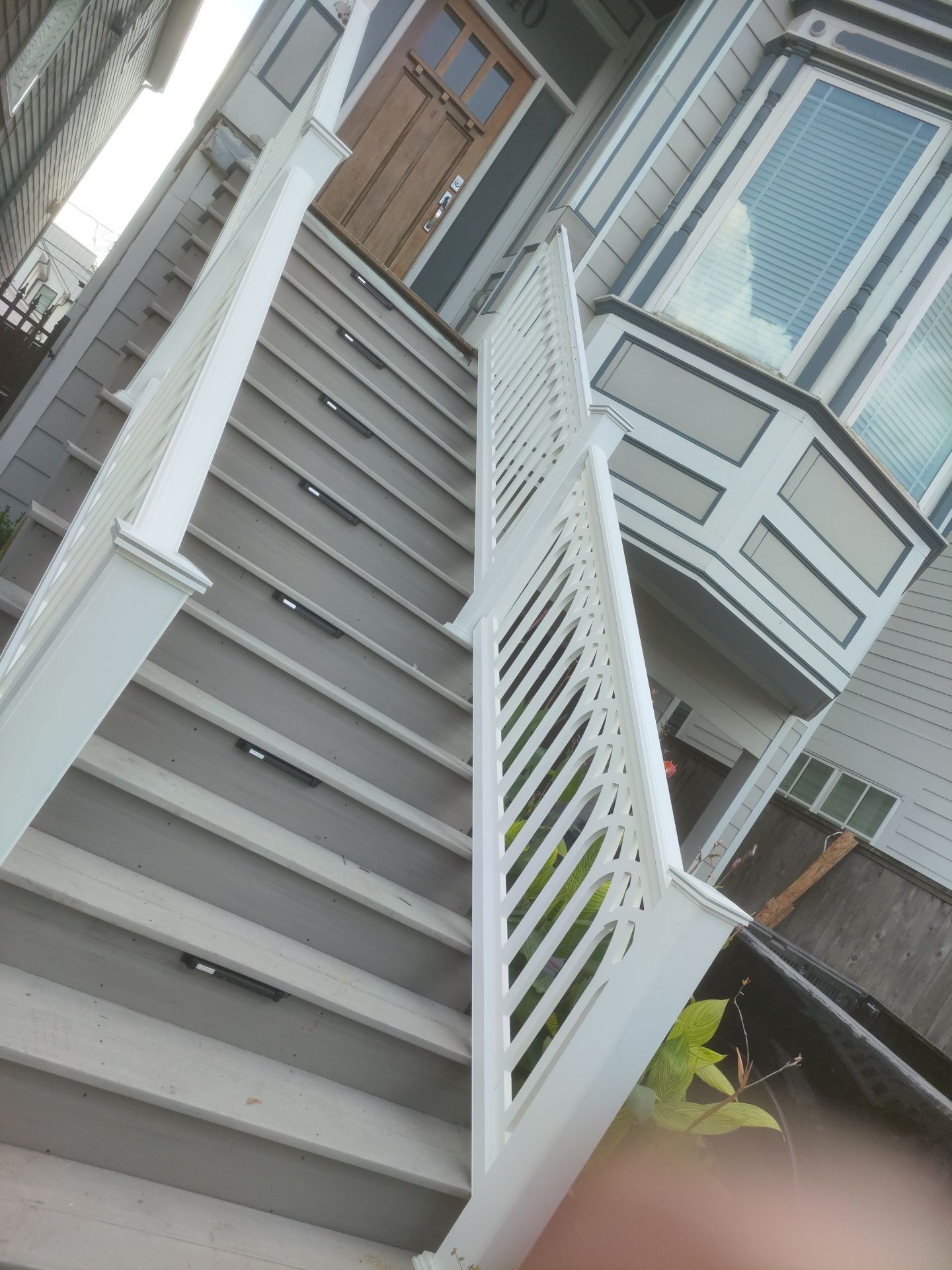 Timbertech Staircase with a 50 year warranty and solar lighting by Majesty Construction