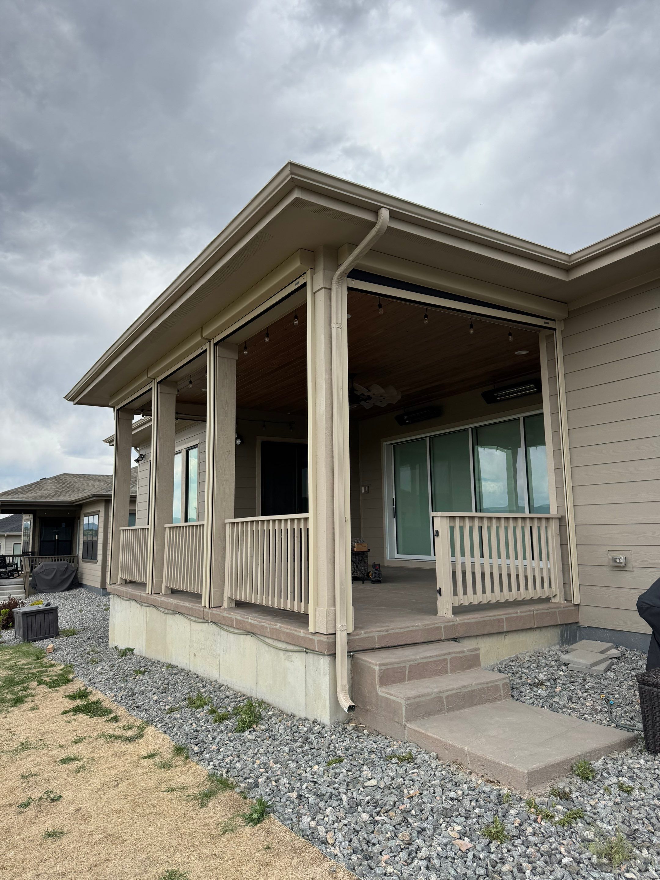 Exterior MagnaTrack Solar Screen Installation on Castle Rock Covered Patio by Outdoor Solutions Colorado