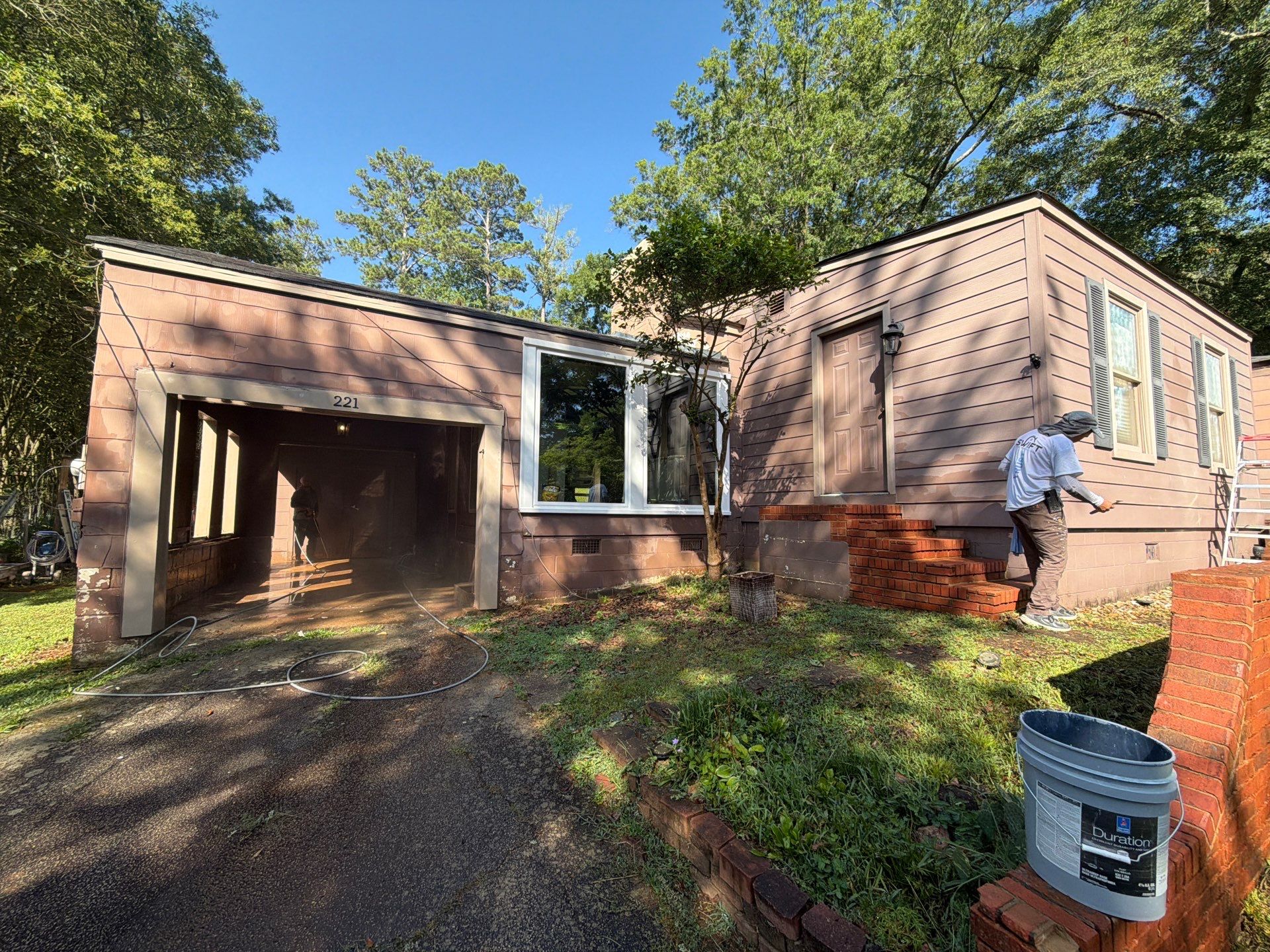 Full Exterior Repaint with Navy Blue and White Trim by Swift Home Renovations