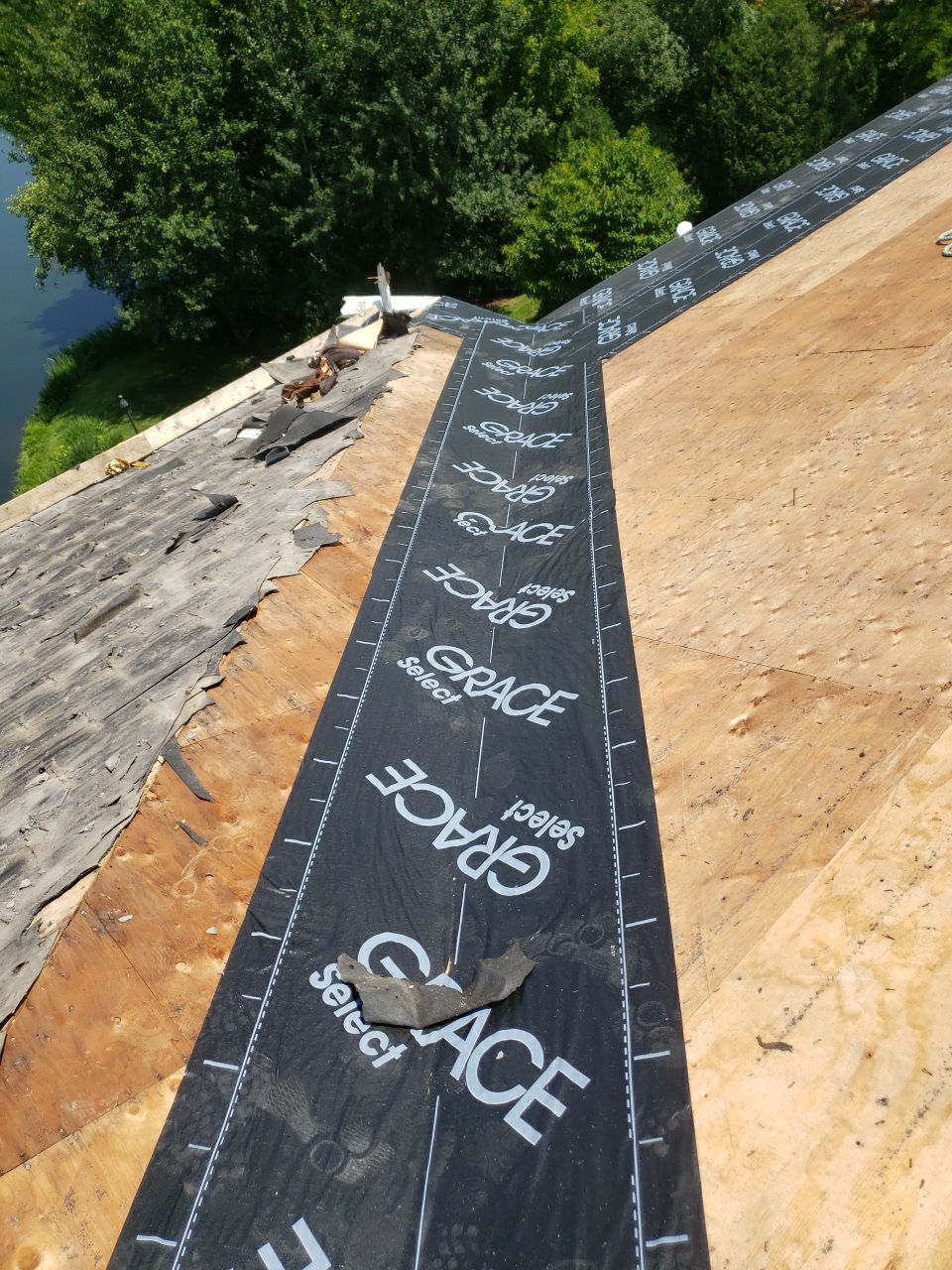 DaVinci Slate Roof Installation and Aluminum Gutter by Custom Installations