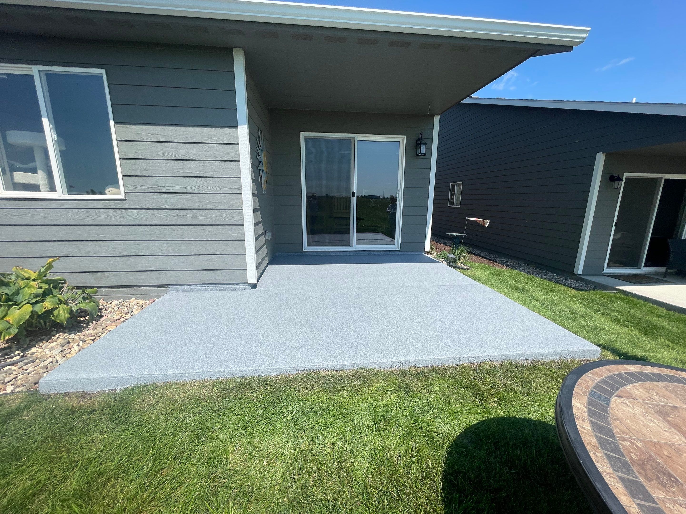 Starry Evening Concrete Patio Coating Installation in Tea by Select Painting, Coatings & Garage Cabinets