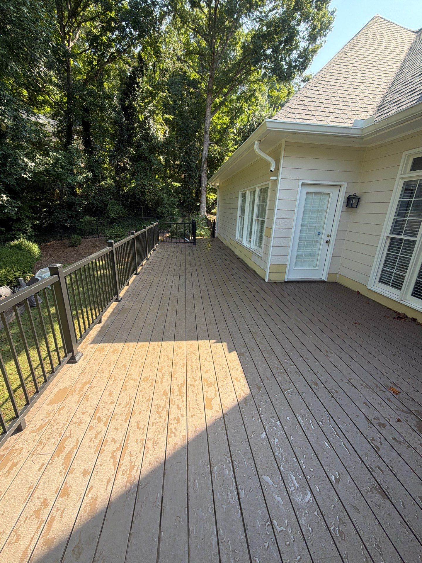 Elevated Composite Deck Replacement with Metal Railings in Smyrna by Swift Home Renovations 