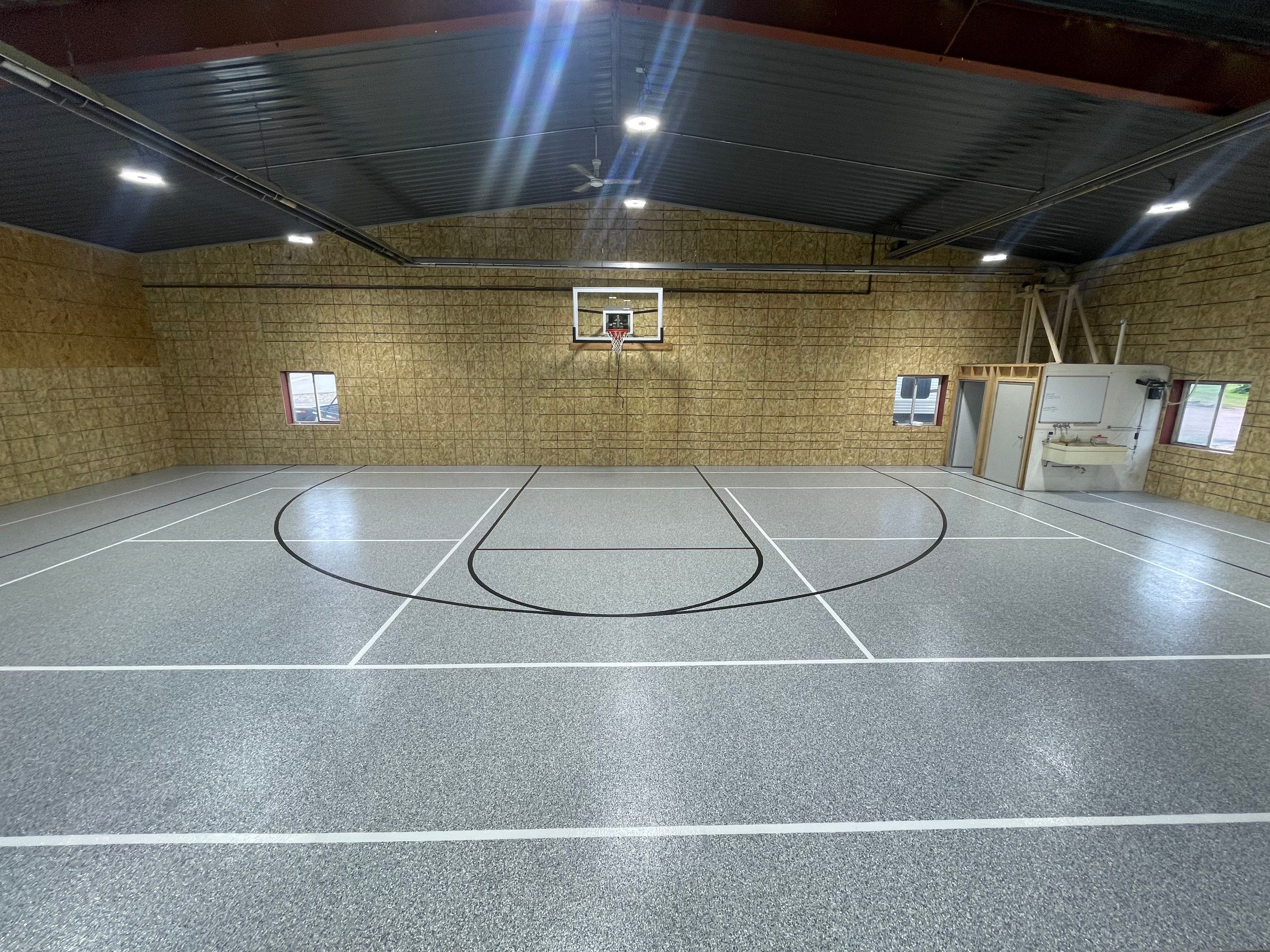 Custom Polyurea Shop Floor with Basketball Court Lines in Rock Valley by Select Painting, Coatings & Garage Cabinets