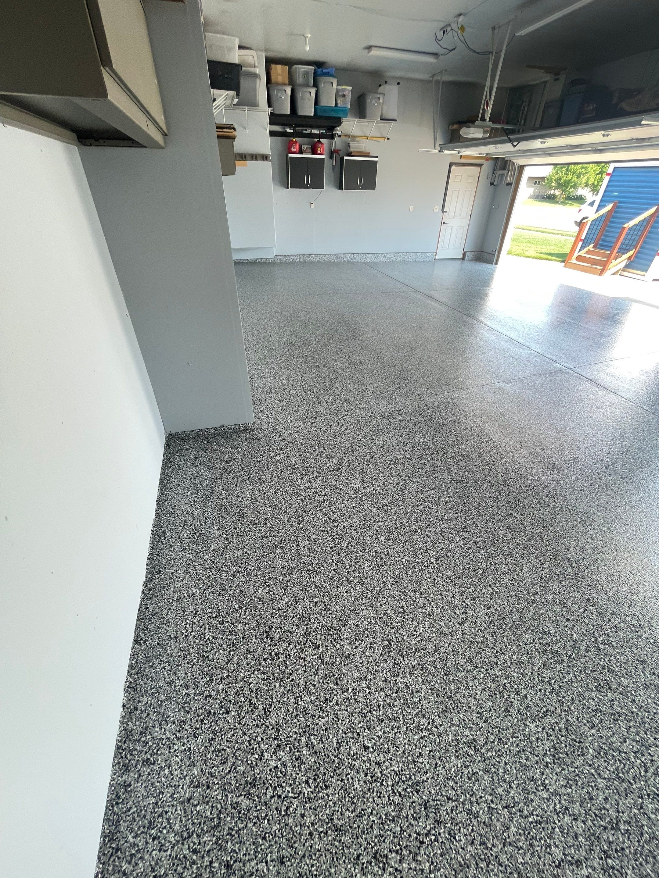 Sioux Falls Garage Concrete Coating Installation with Domino Flake by Select Painting, Coatings & Garage Cabinets