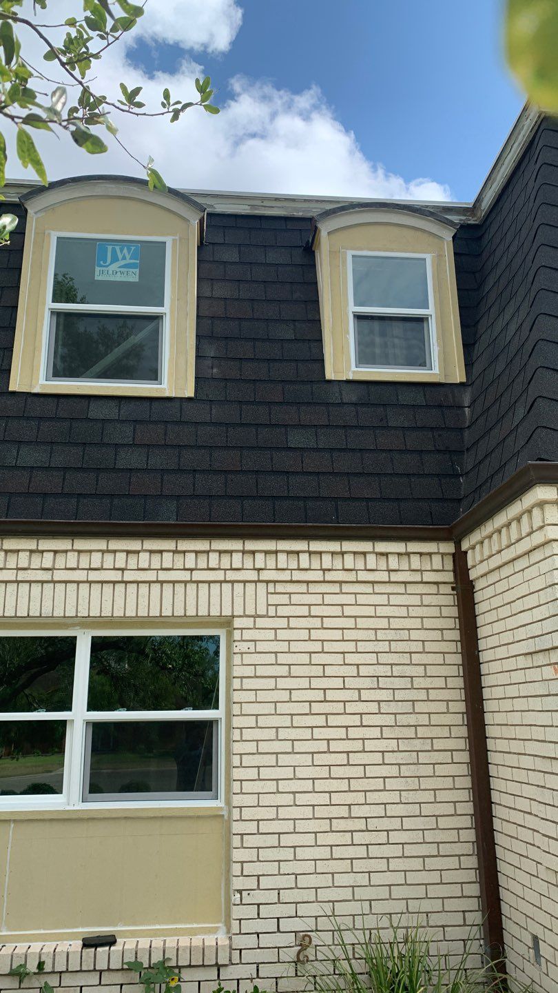 Mansard Charm by Bayfront Roofing and Construction