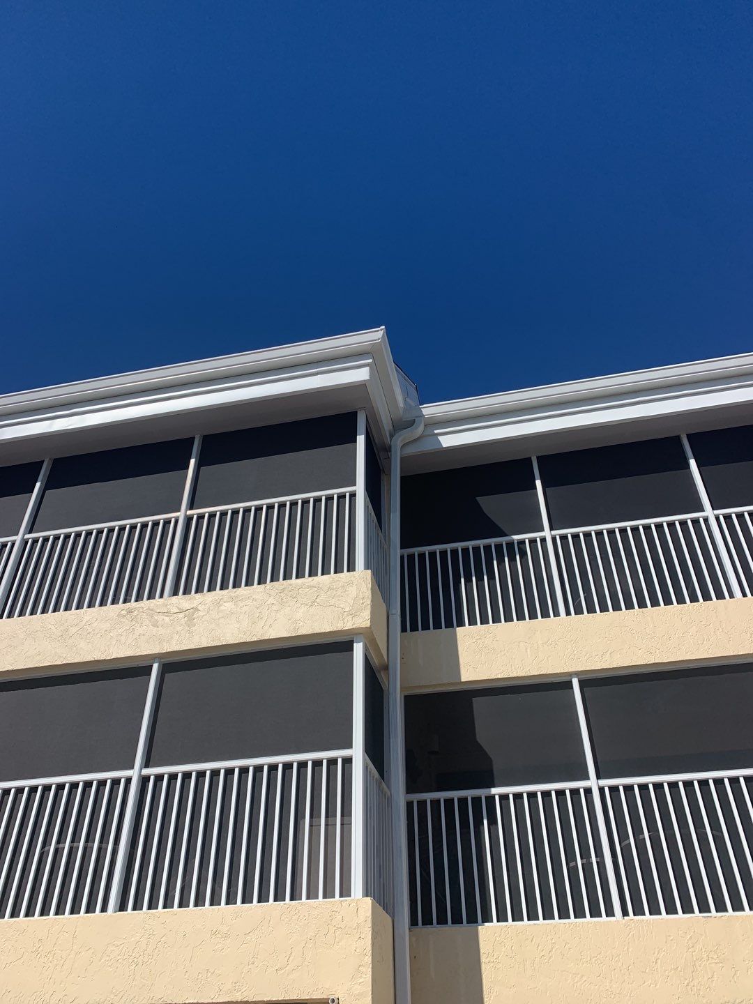 White Seamless Gutters and Downspouts in Sanibel FL by Gutter Professors