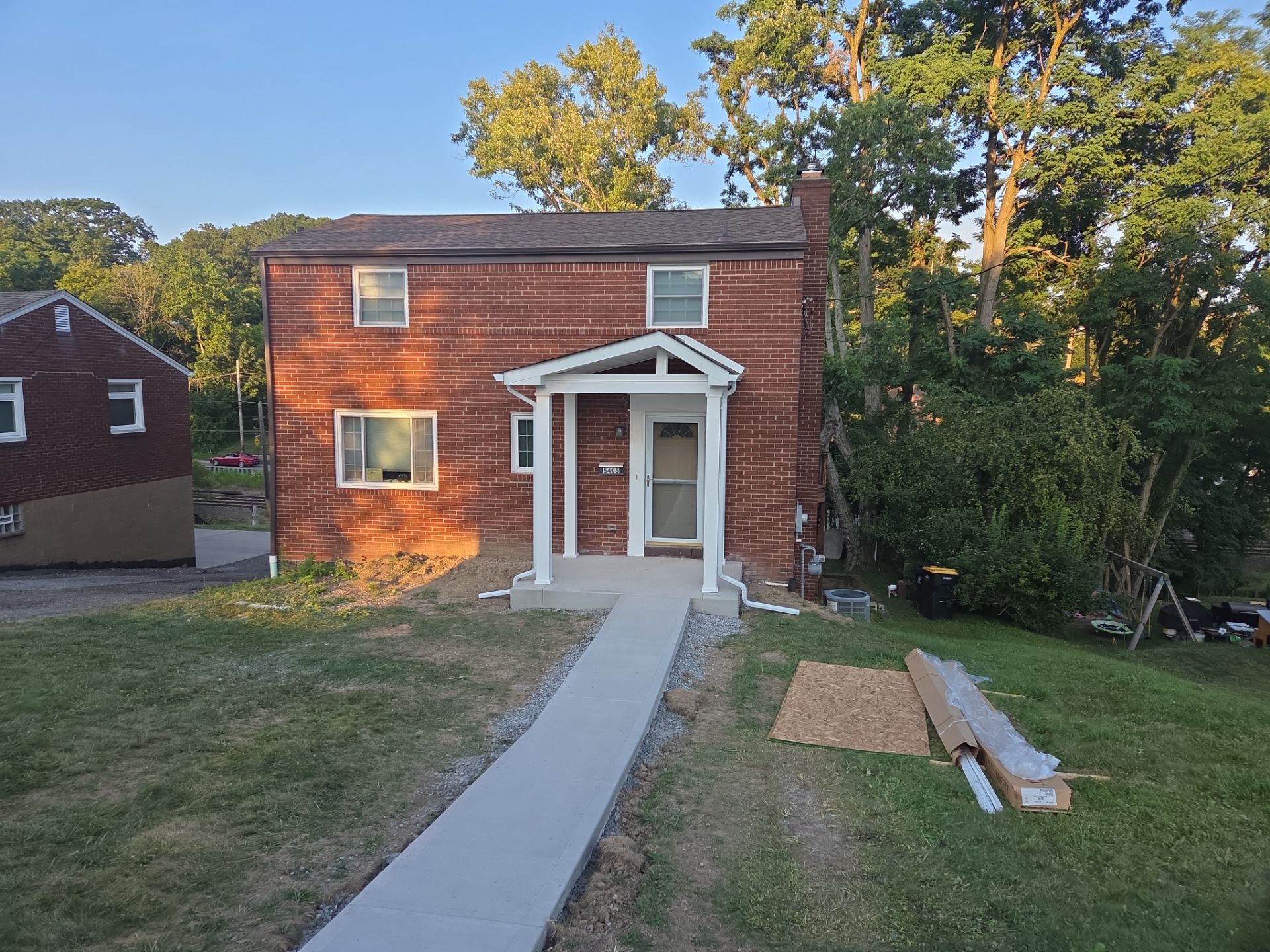 Concret and roof build  by Cousins Roofing Siding & Decks