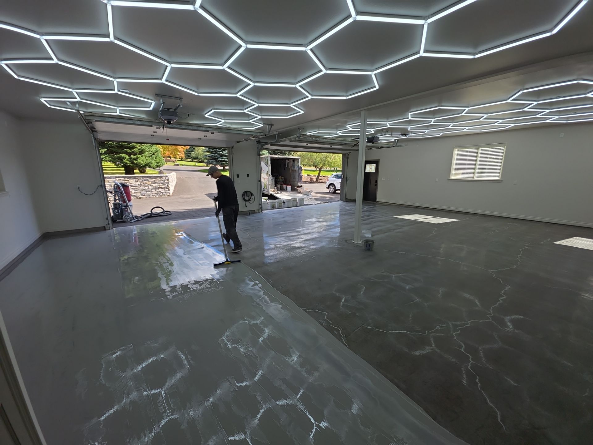 Custom Garage Transformation with Polyaspartic Coating and Hexagonal LED Lighting by Croc Coatings, LLC