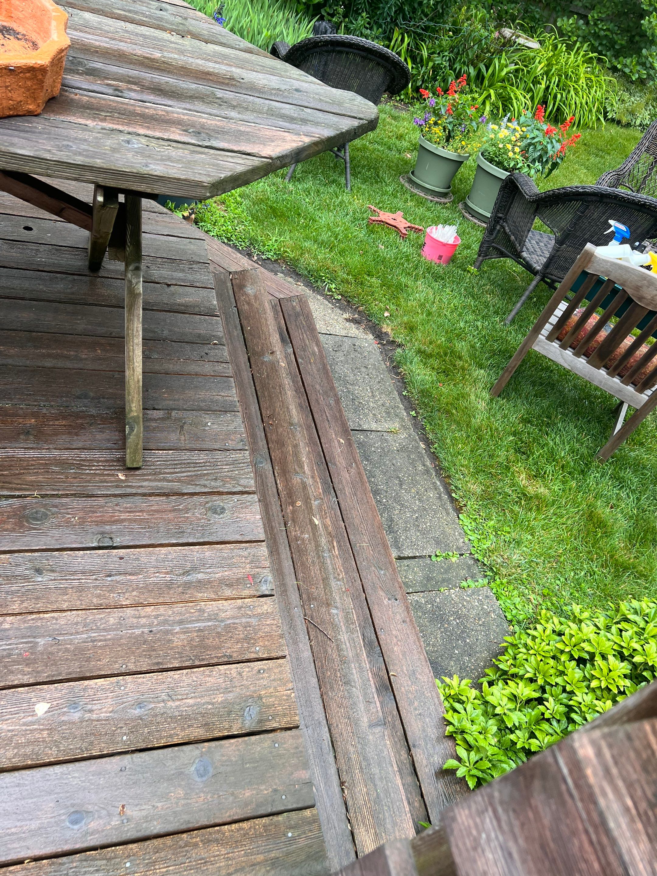 Wood deck cleaning, board replacement and staining by Northern Power Washing LLC.