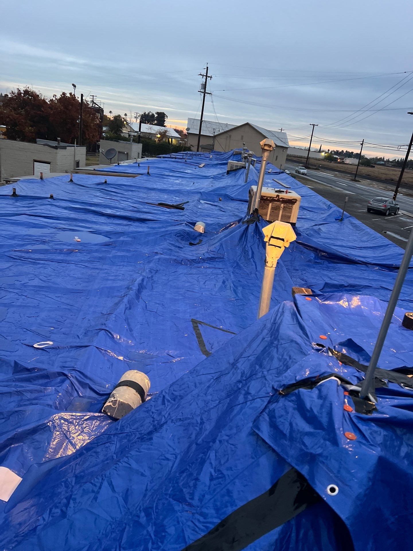 Emergency Roof Tarp Service - Fresno, CA by Grandmark Service Company