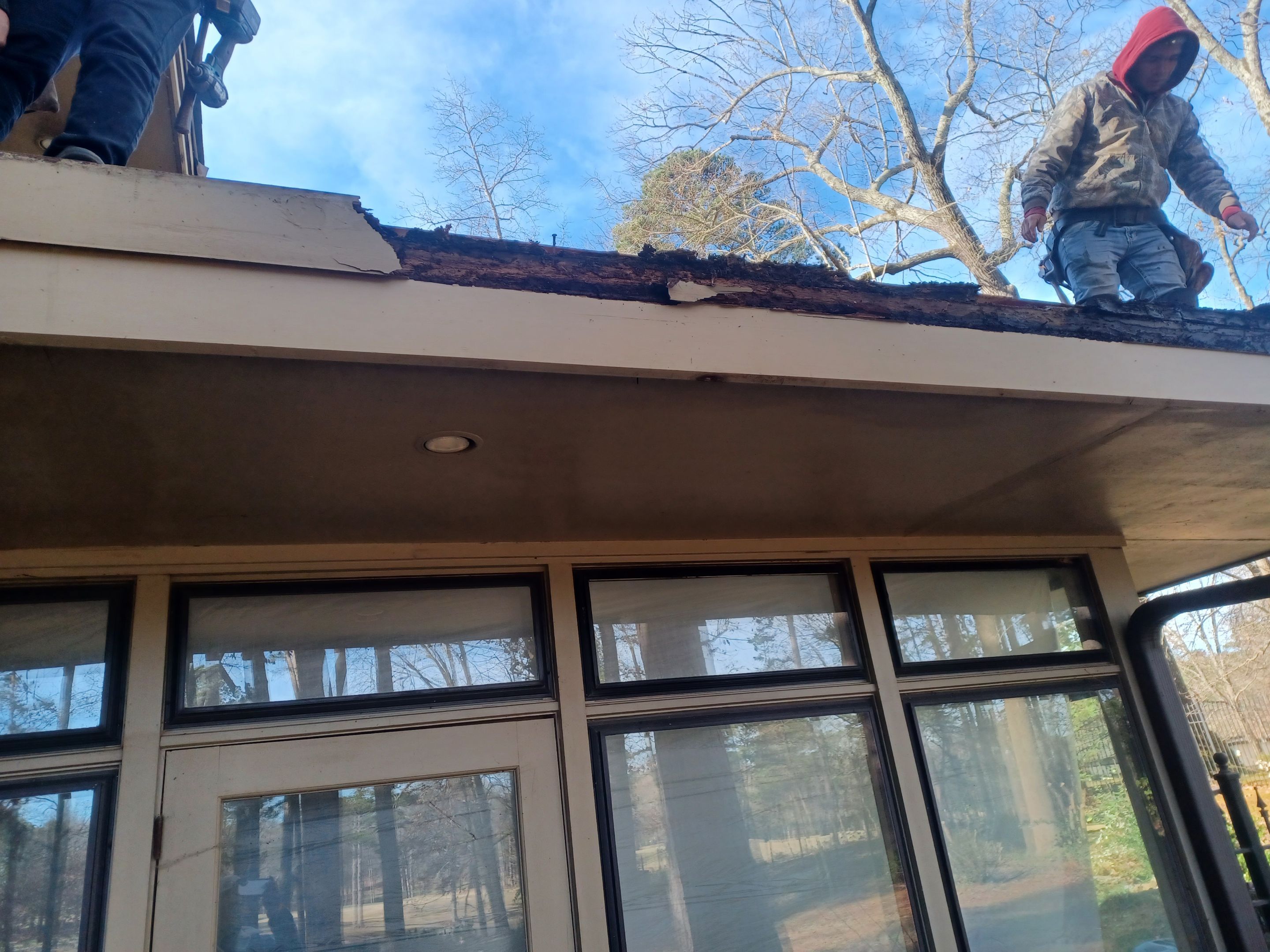 Residential Roofing Installation using PVC membrane and 24 gauge Standing Seam Metal by Hostetler Roofing