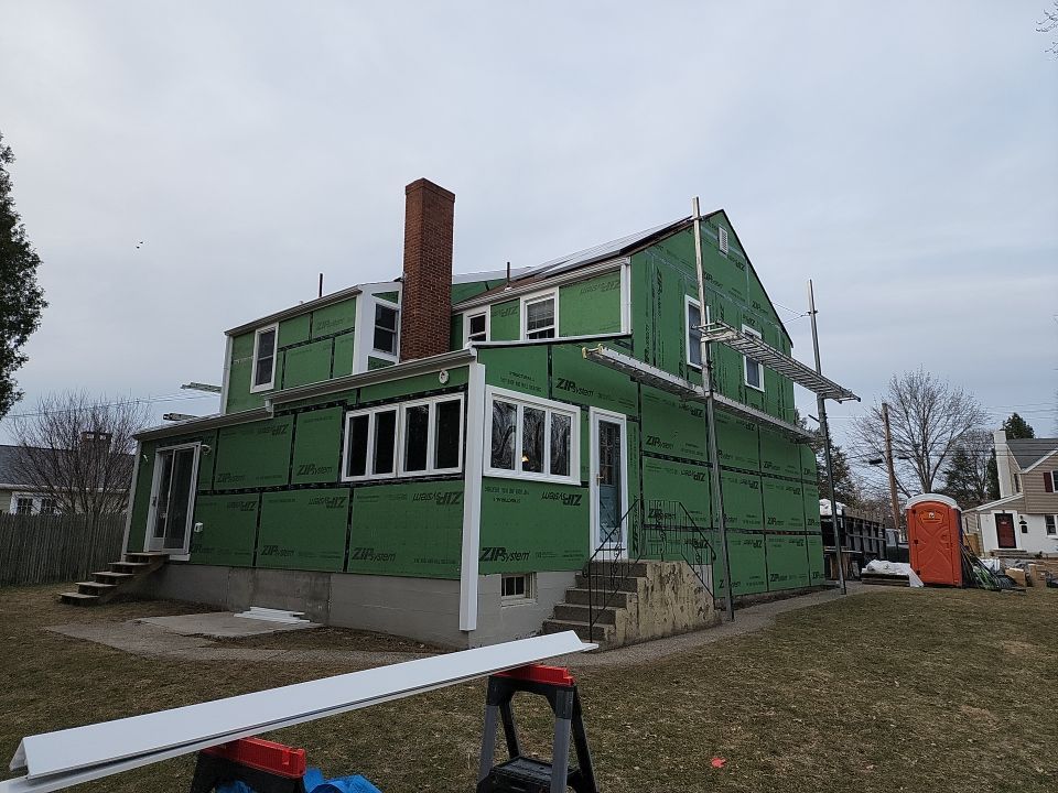 James Hardie siding, new metal roof and couple windows being installed. by UBrothers Construction