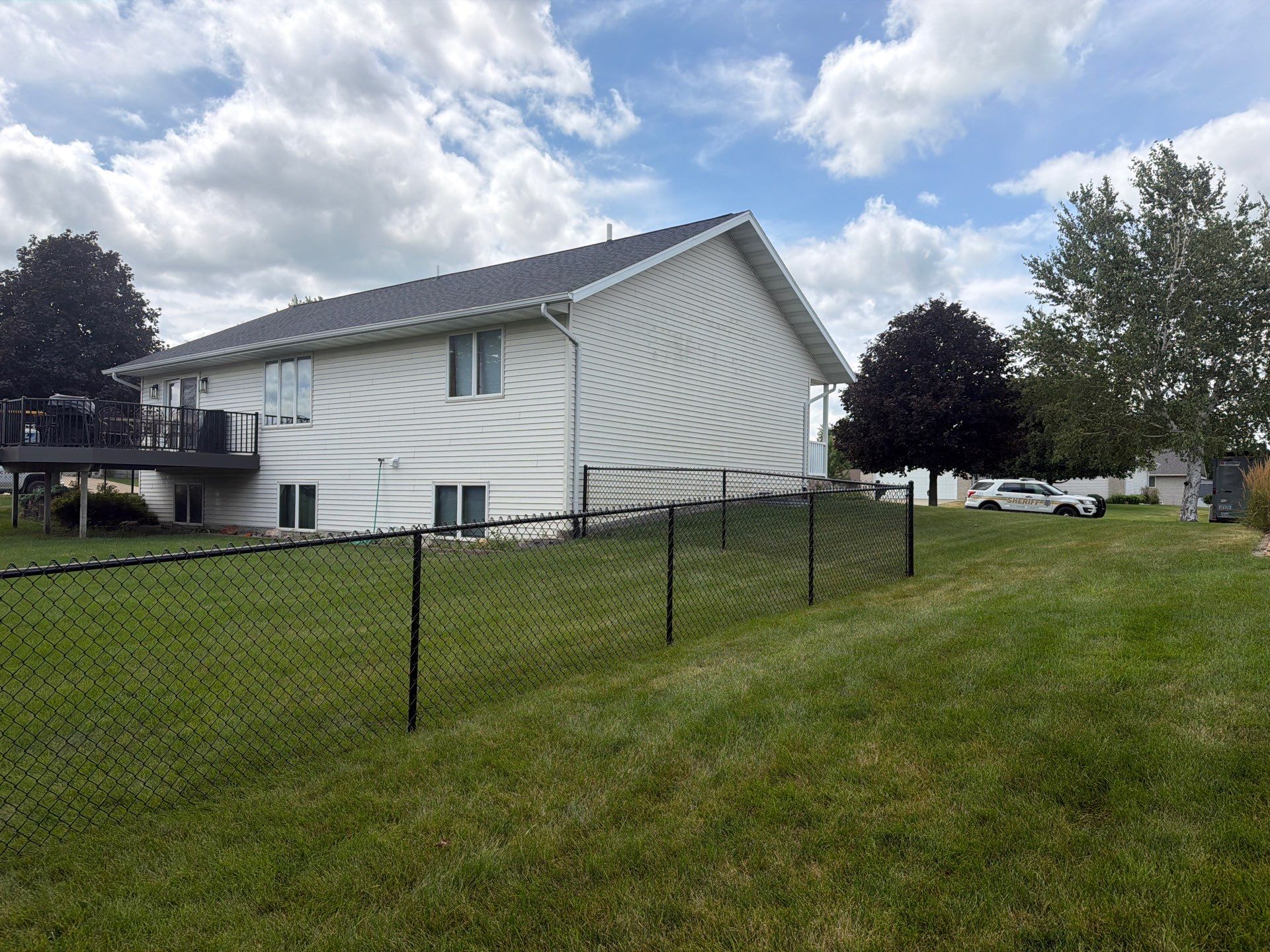 Black Vinyl-Coated Chain Link Fence Installation in Fairbank by Perfect Picket Fence and Stain